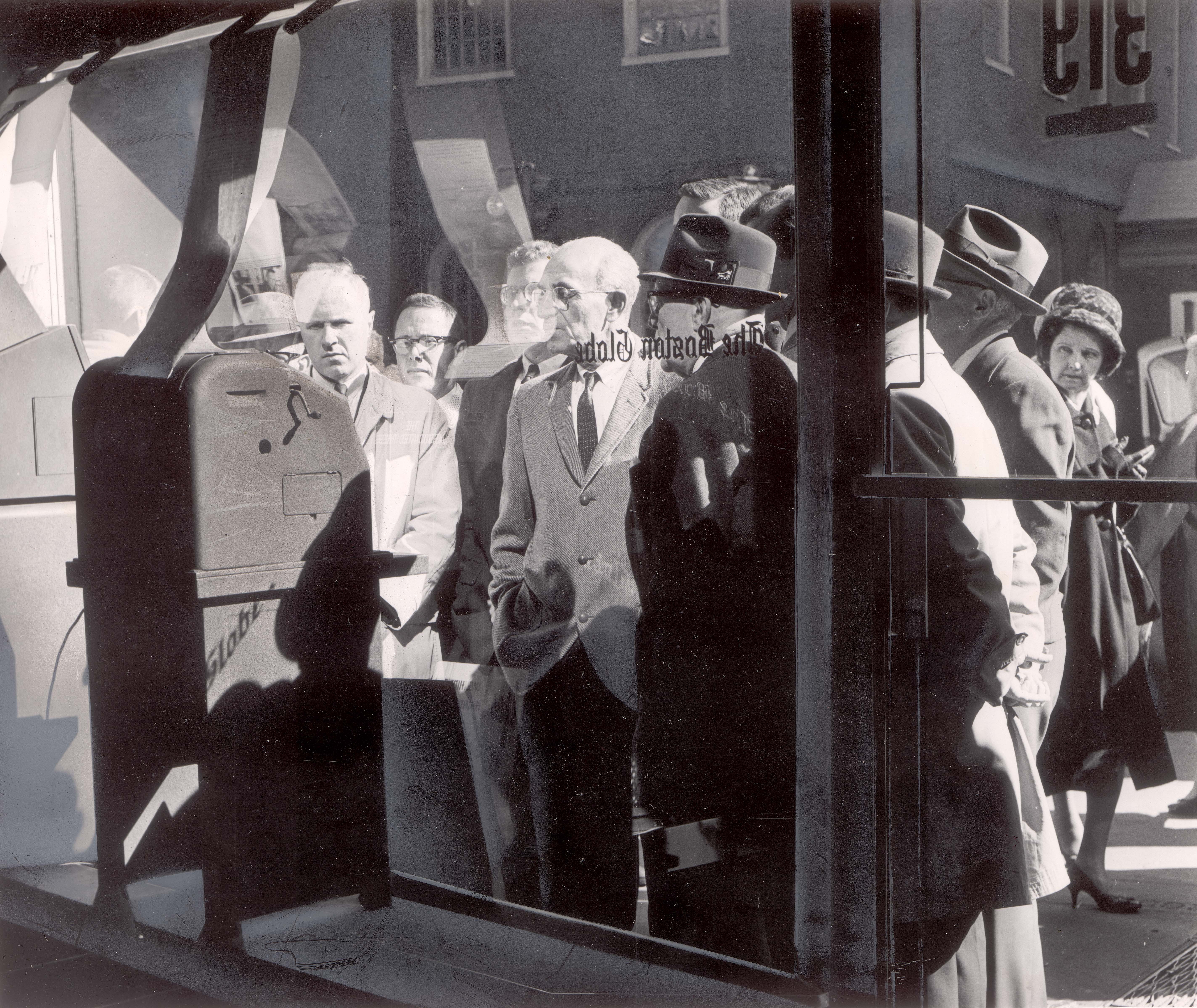 Anxious watchers checked the Associated Press teletype machine at the Boston Globe's downtown office as President John F. Kennedy declared a blockade of military equipment bound for Cuba. in October, 1962.