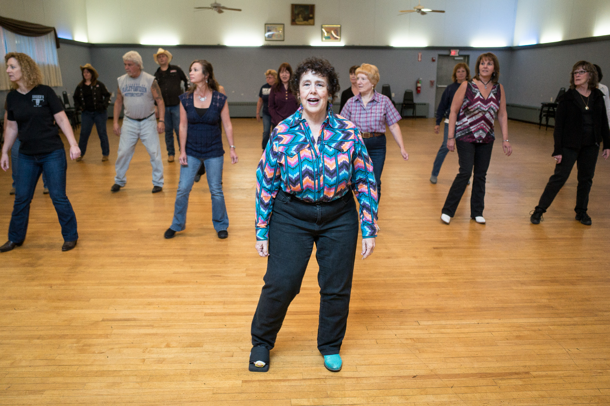 Country western dancing instructor Julie Kaufmann of Medford leads a group during an afternoon session at the Moose Lodge in North Reading.