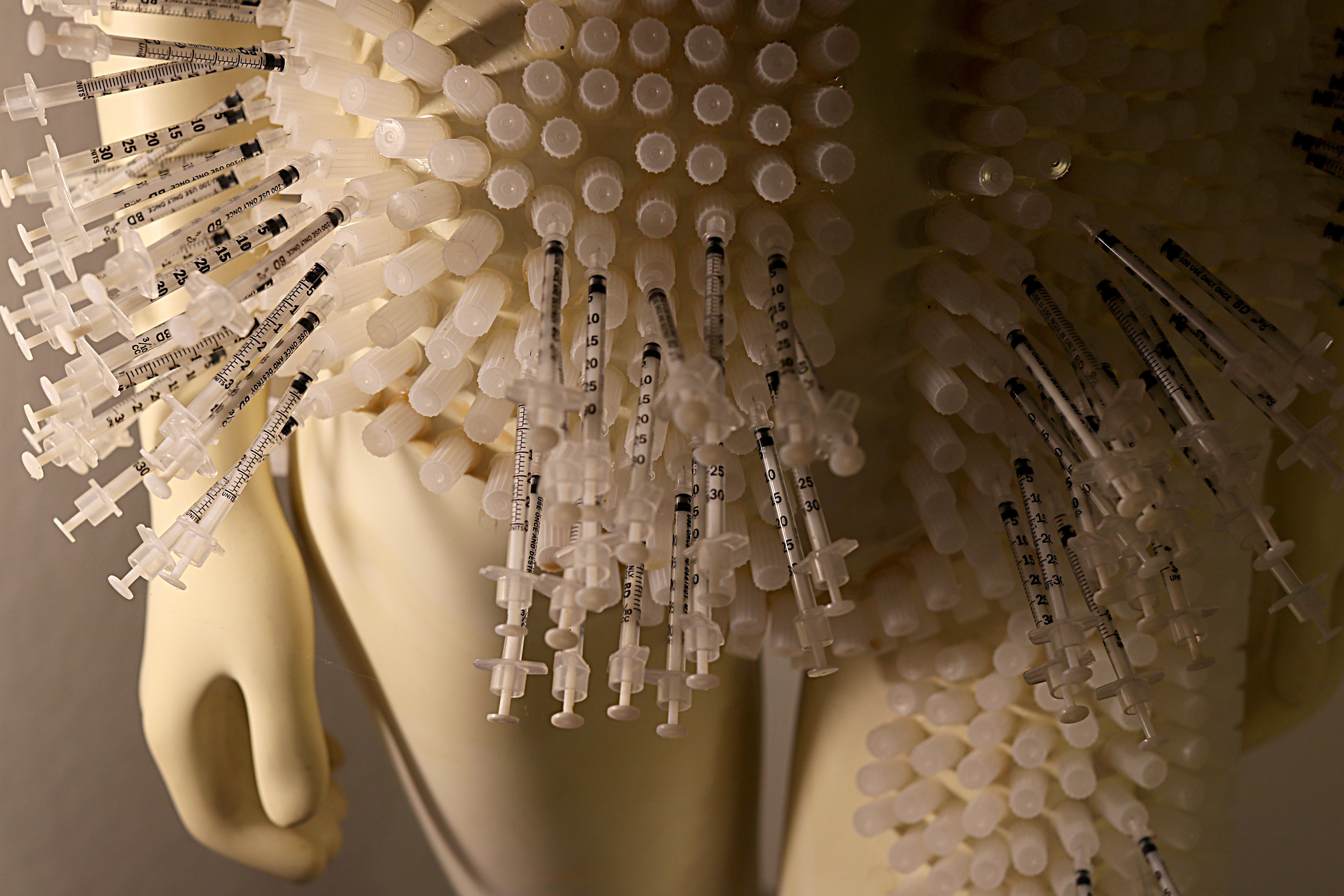 In one corner of Janine Fay’s basement installation stands a mannequin stuck full of syringes: Our Lady of Perpetual Injections.