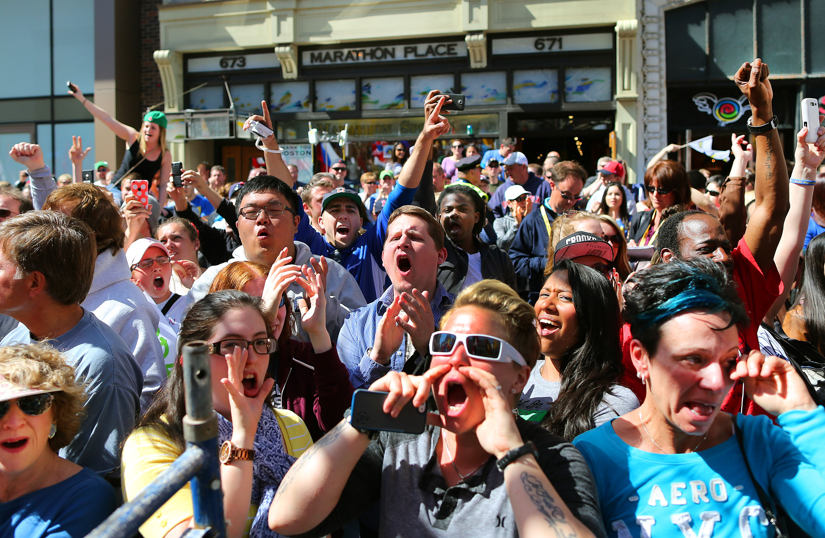 Following a 2:49 p.m. moment of silence to mark the 2013 attacks, spectators erupted at the Boylston Street site of the first blast.