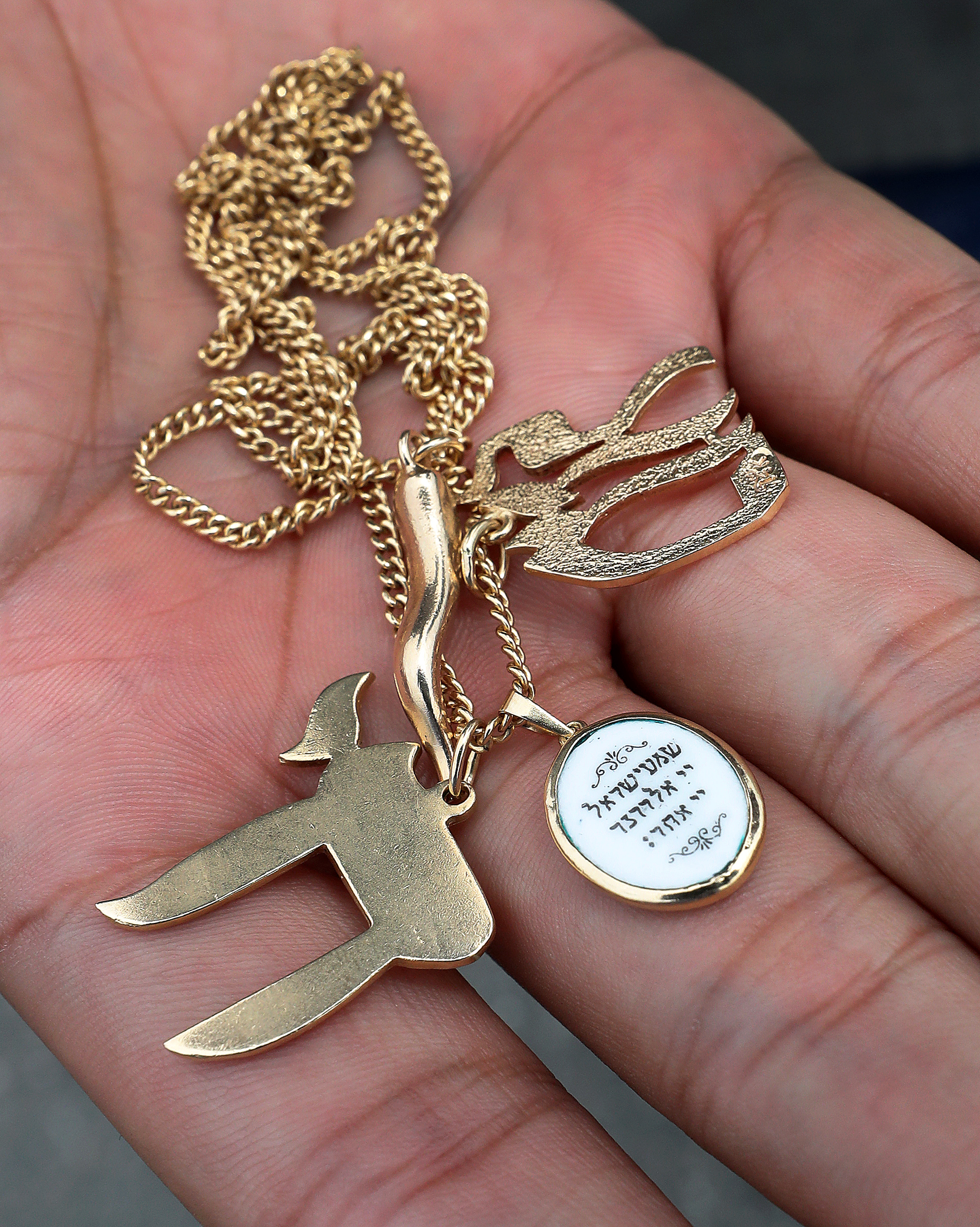 Jordan Avery wears a chain around his neck with Hebrew letters and Jewish prayers.