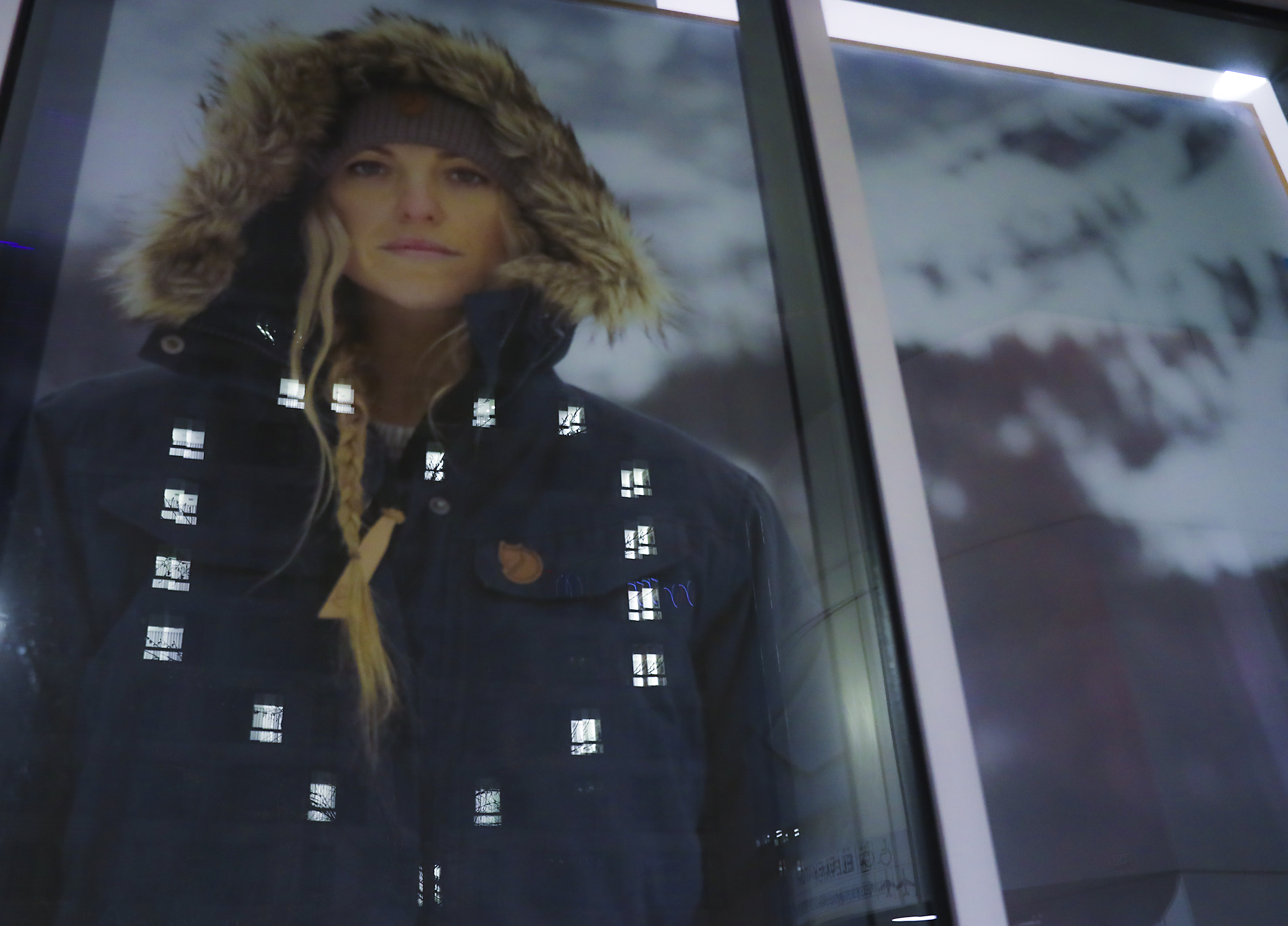 The heart on the Yotel building on Seaport Blvd is reflected on the window of the Fjällräven Seaport store.