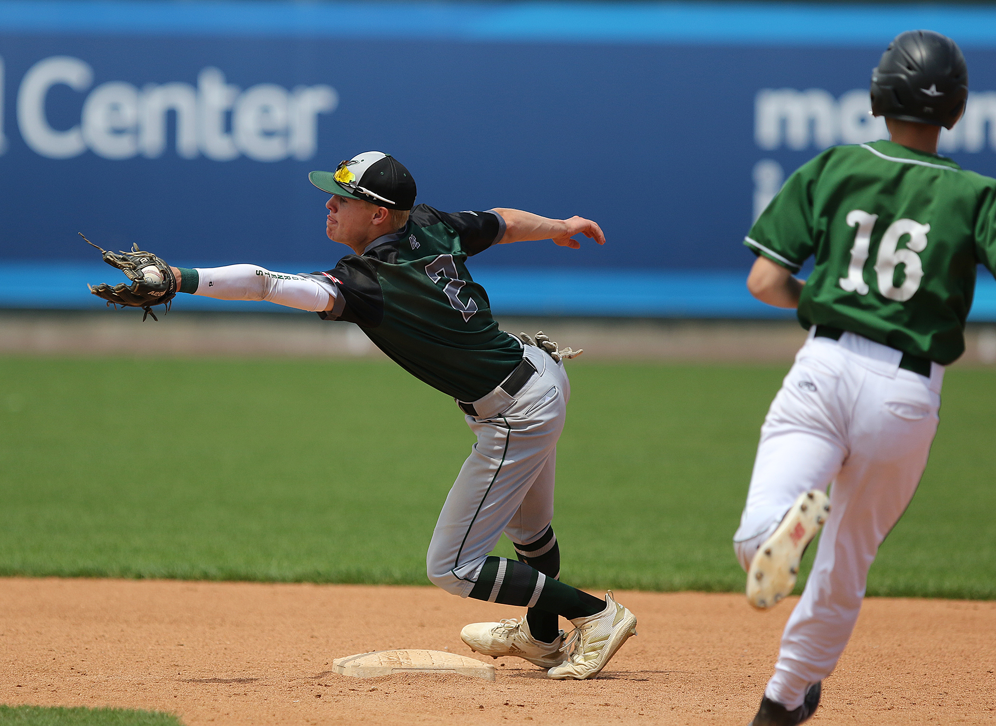 Manchester Essex's Lars Arnsten snags this throw to make an out against Tahanto's John DiFonzo in Saturday’s Division 4 baseball final at LeLacheur Park in Lowell.