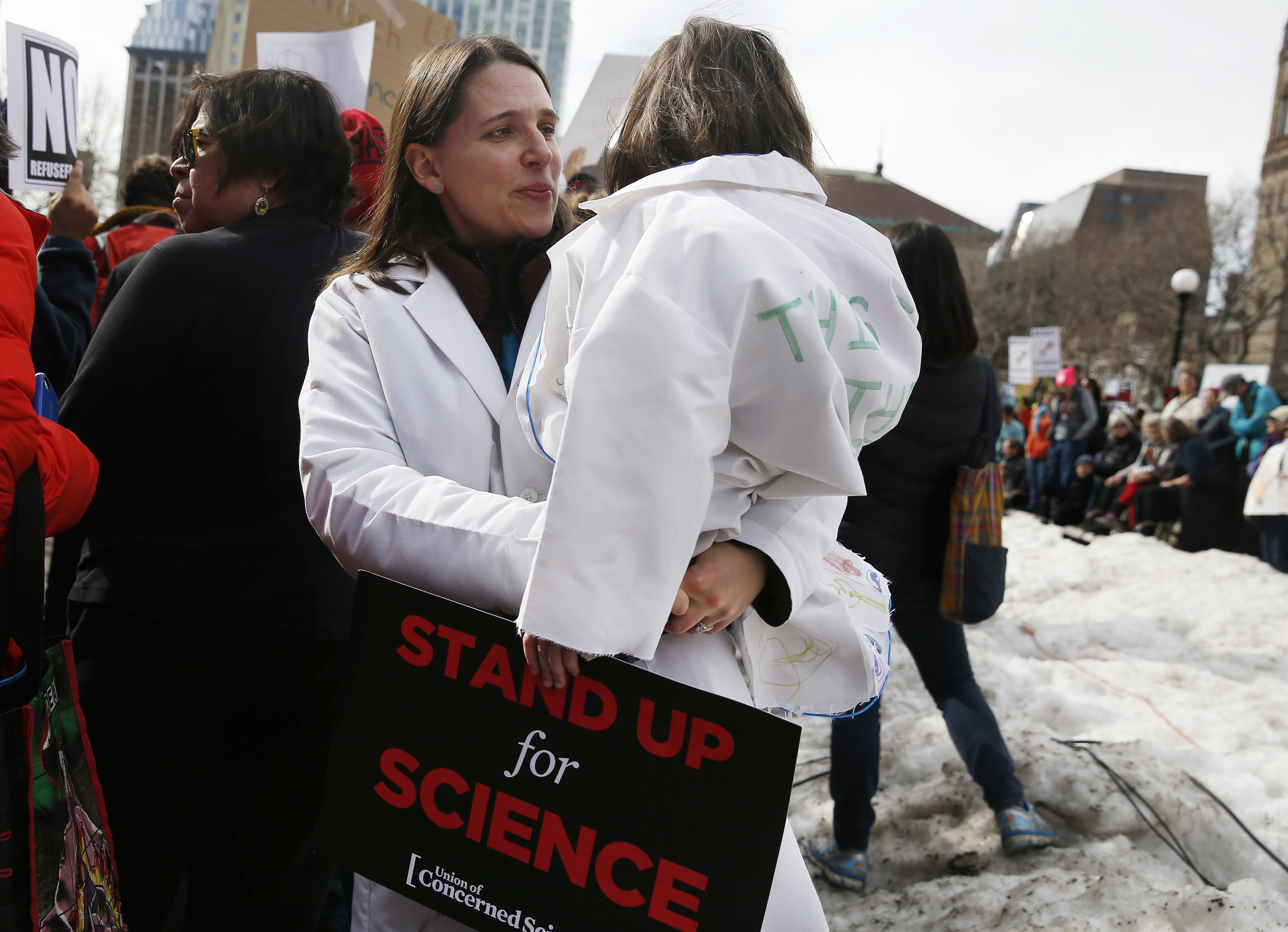 Heather Ferris, a Diabetes researcher from Newton, held her daughter, Paige Lester, 4, as they stood in Copley Square.