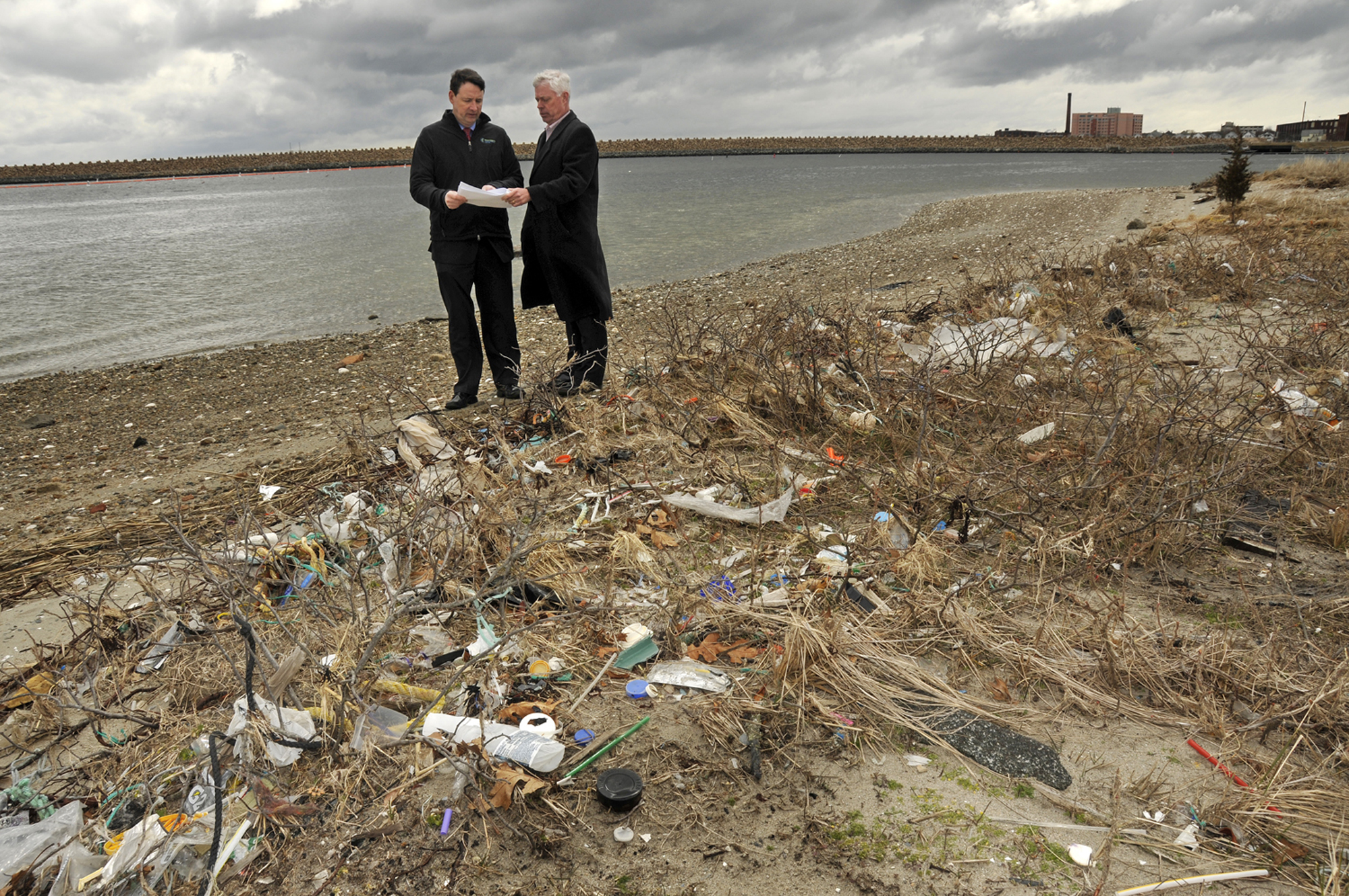 Bill White (left), director of offshore wind energy programs for the Massachusetts Clean Energy Center, and state energy and environmental affairs secretary Rick Sullivan discussed plans at the future New Bedford Marine Commerce Terminal site.