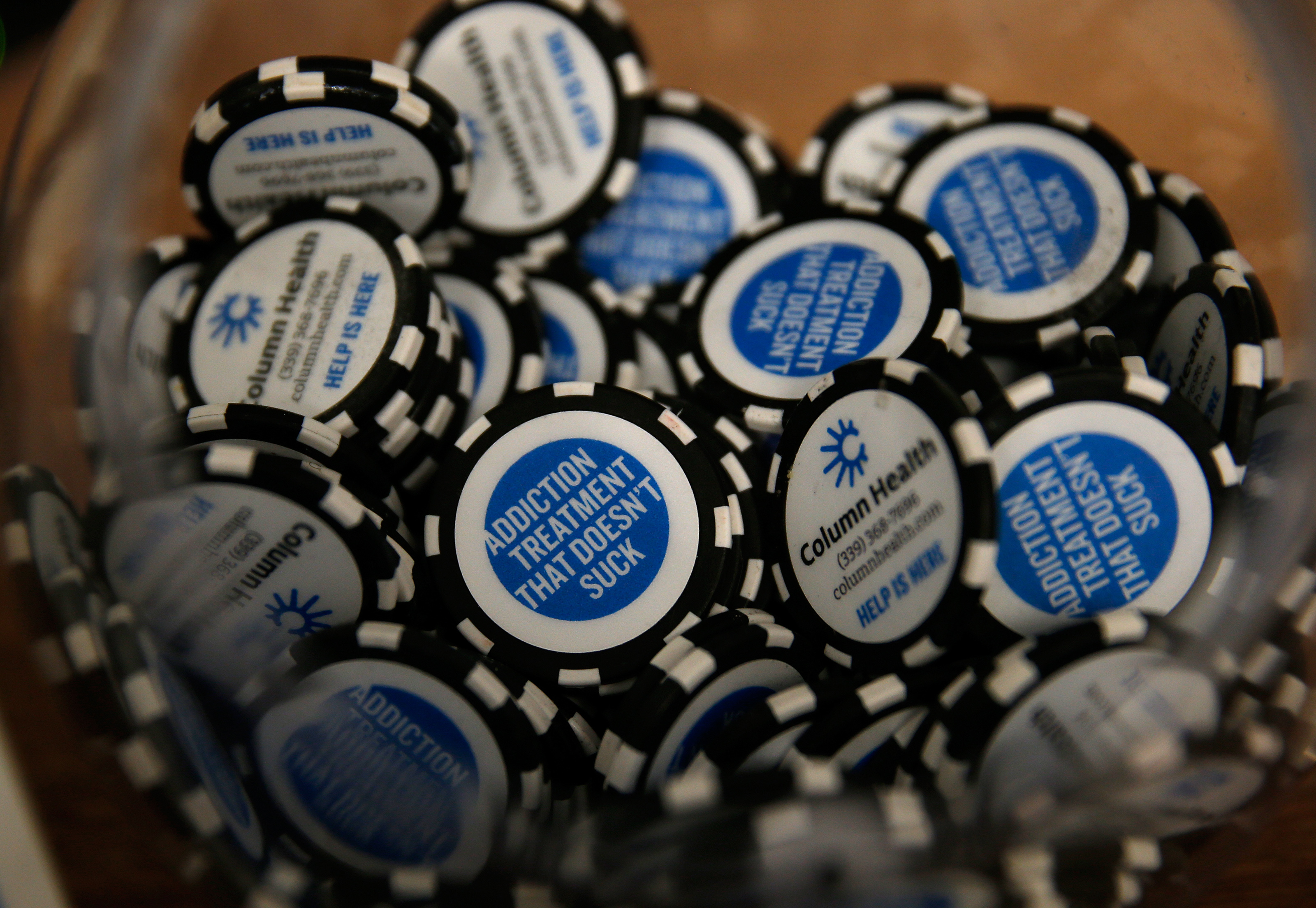Column Health business cards are printed as chips with the slogan “addiction treatment that doesn't suck."