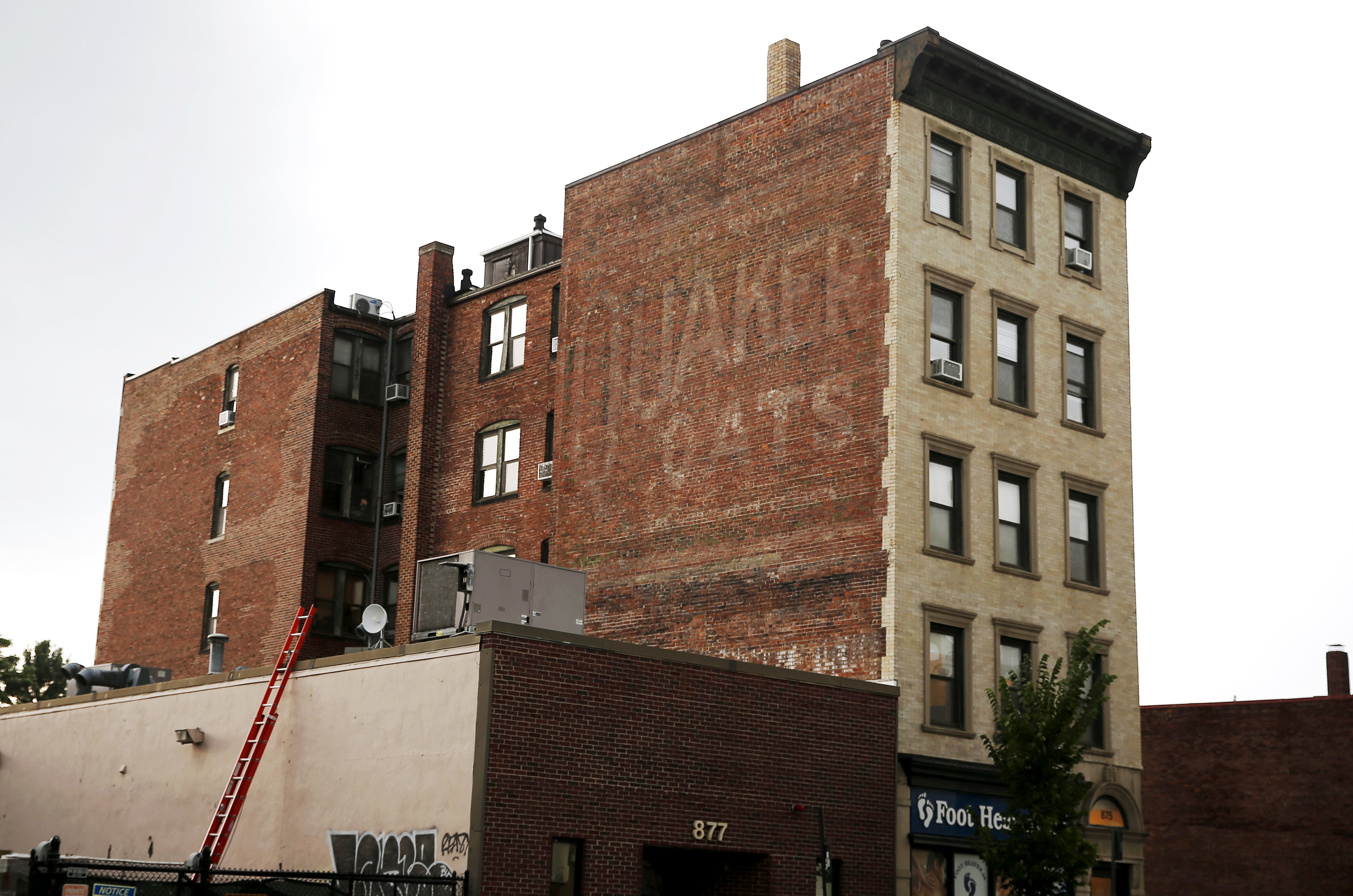 An old Quaker Oats ad above a storefront on Mass. Ave in Cambridge.