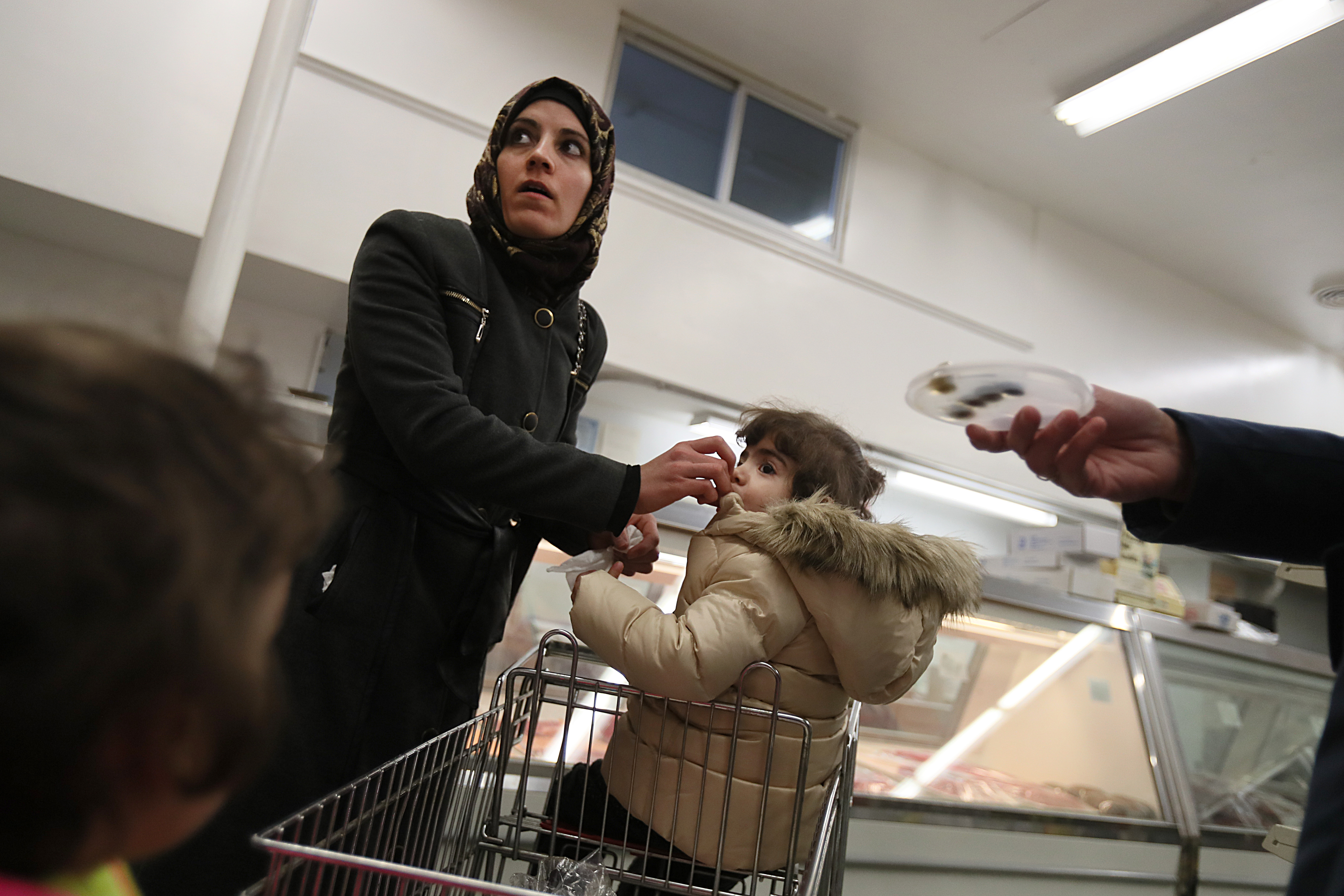 In her first few days in America, Asmaa and her family felt like strangers in a strange land. A volunteer had taken her to shop for the first time at a halal market.