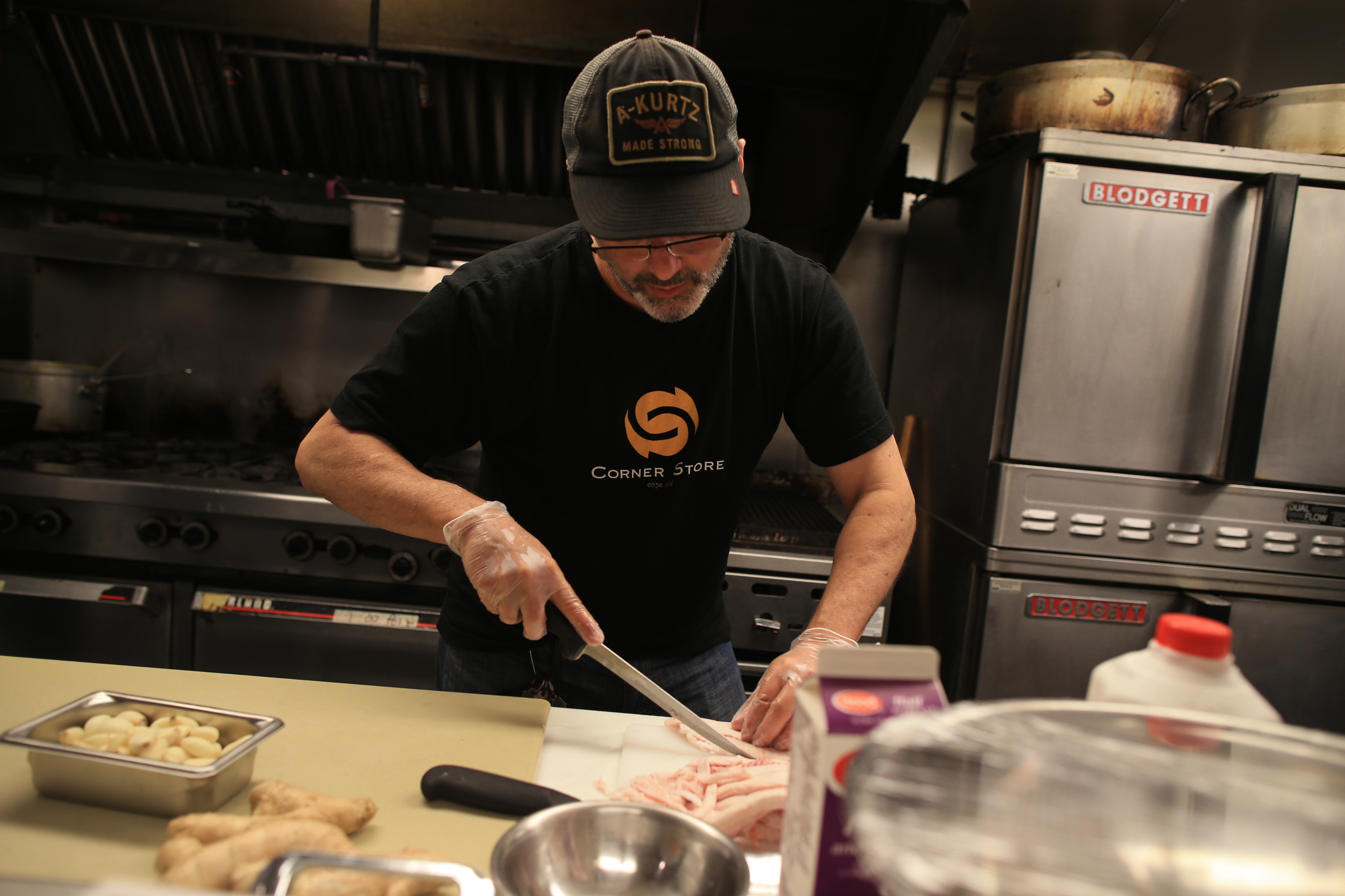Steve DeLeonardis trimmed the fresh-caught cape shark at his Corner Store restaurant in Chatham.