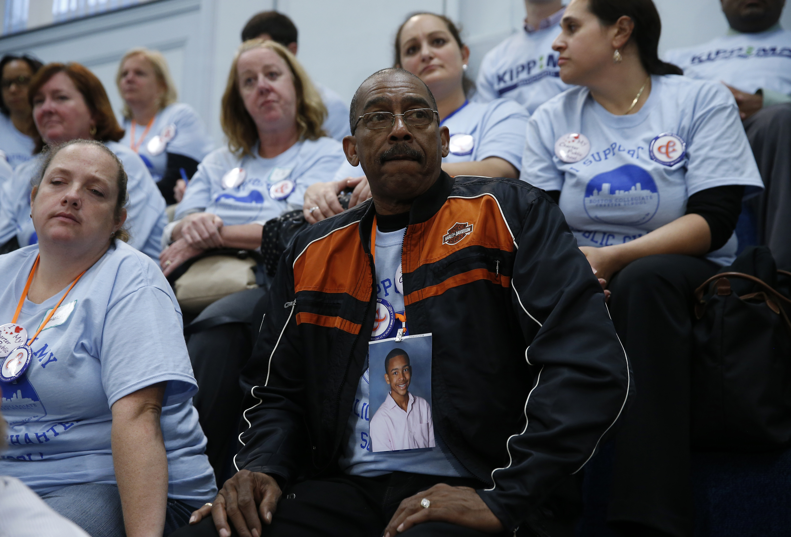 Ricardo Mattier of Dorchester wore a picture of his son, Justyn, a Boston Collegiate Charter School student, as Governor Charlie Baker testified at the hearing.