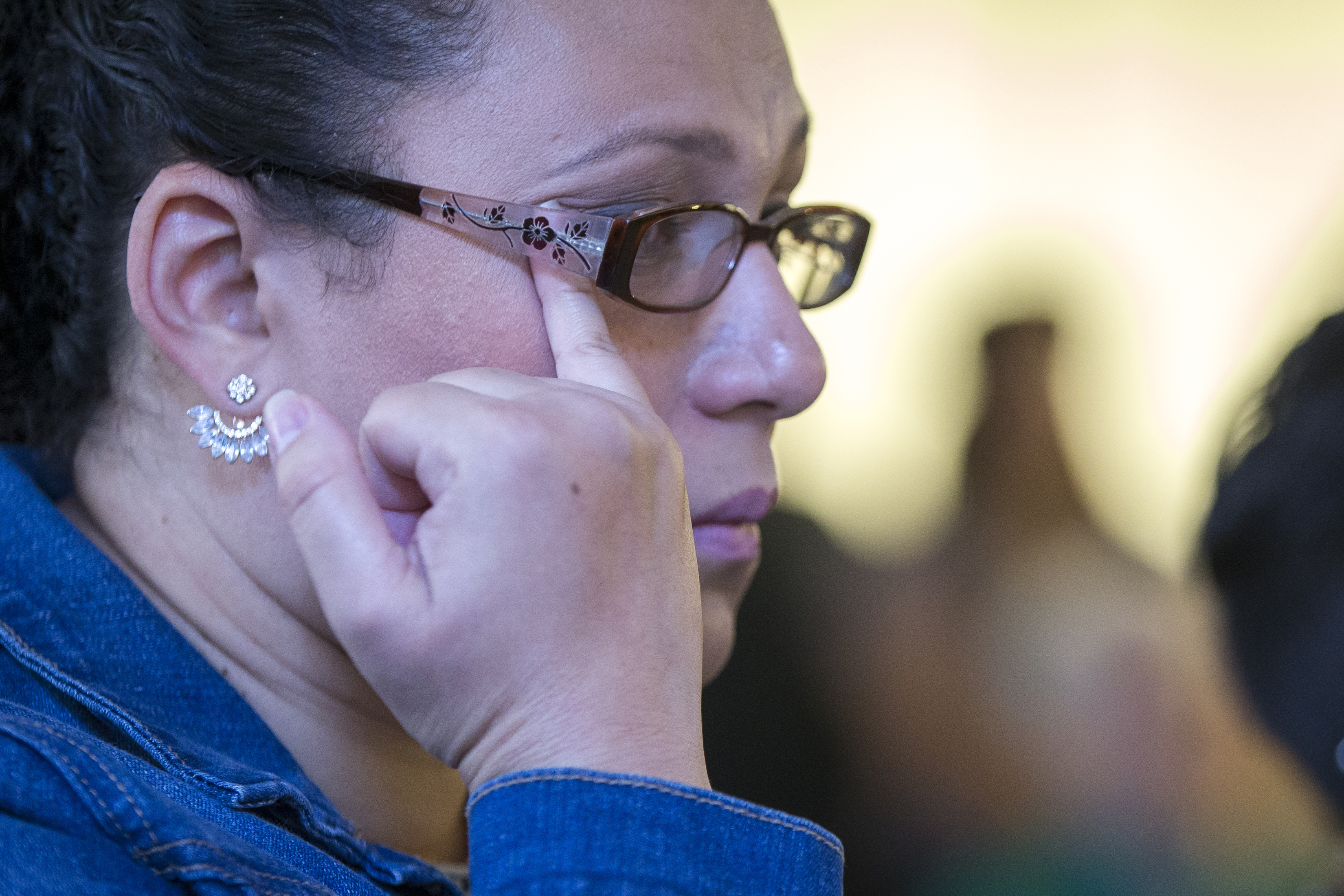 Mariela Sanchez of Tegucigalpa, Honduras wiped away tears during Monday’s news conference. Trump administration critics are calling the policy inhumane.