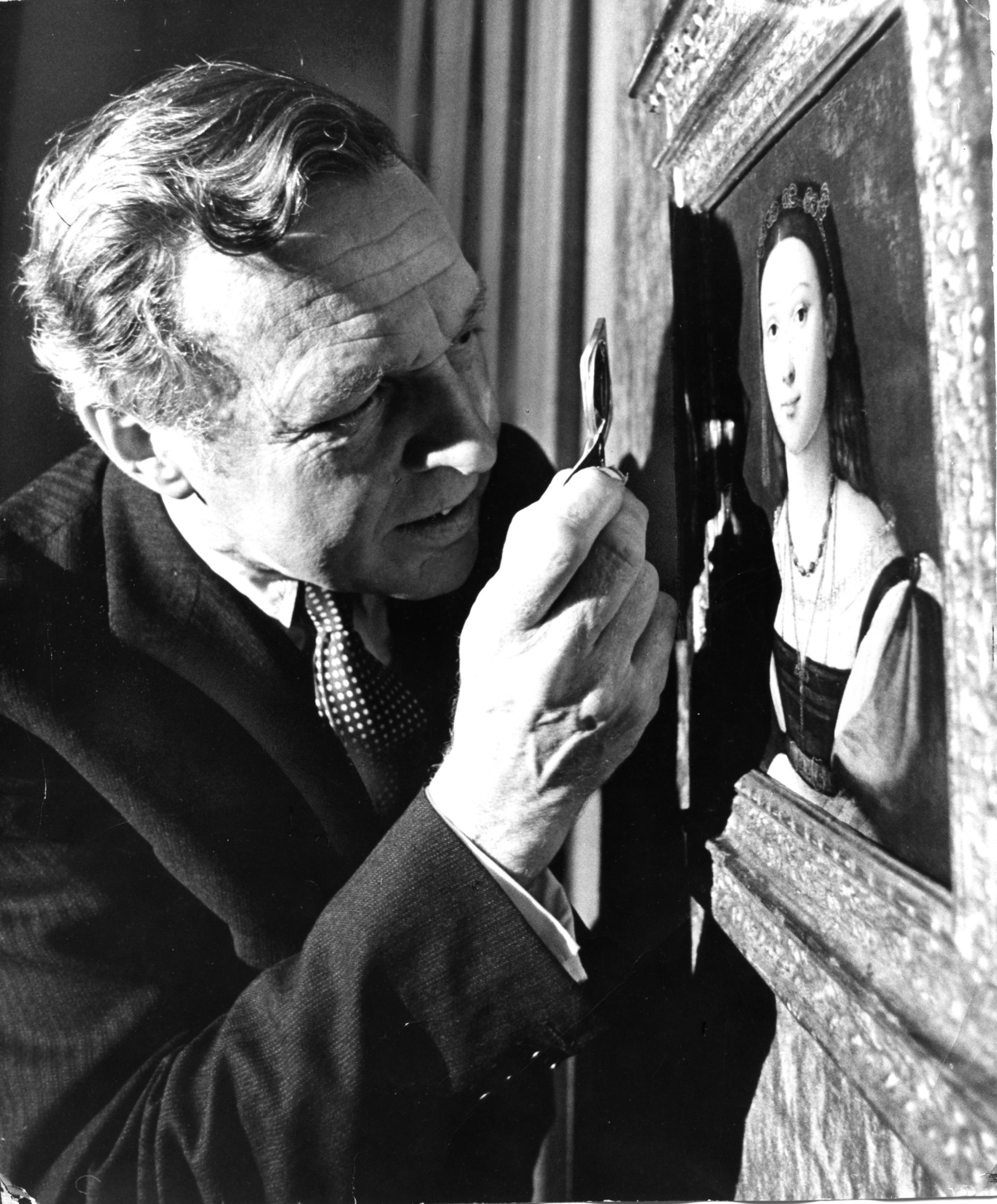 MFA director Perry Rathbone examines the portrait that became the center of an art controversy.