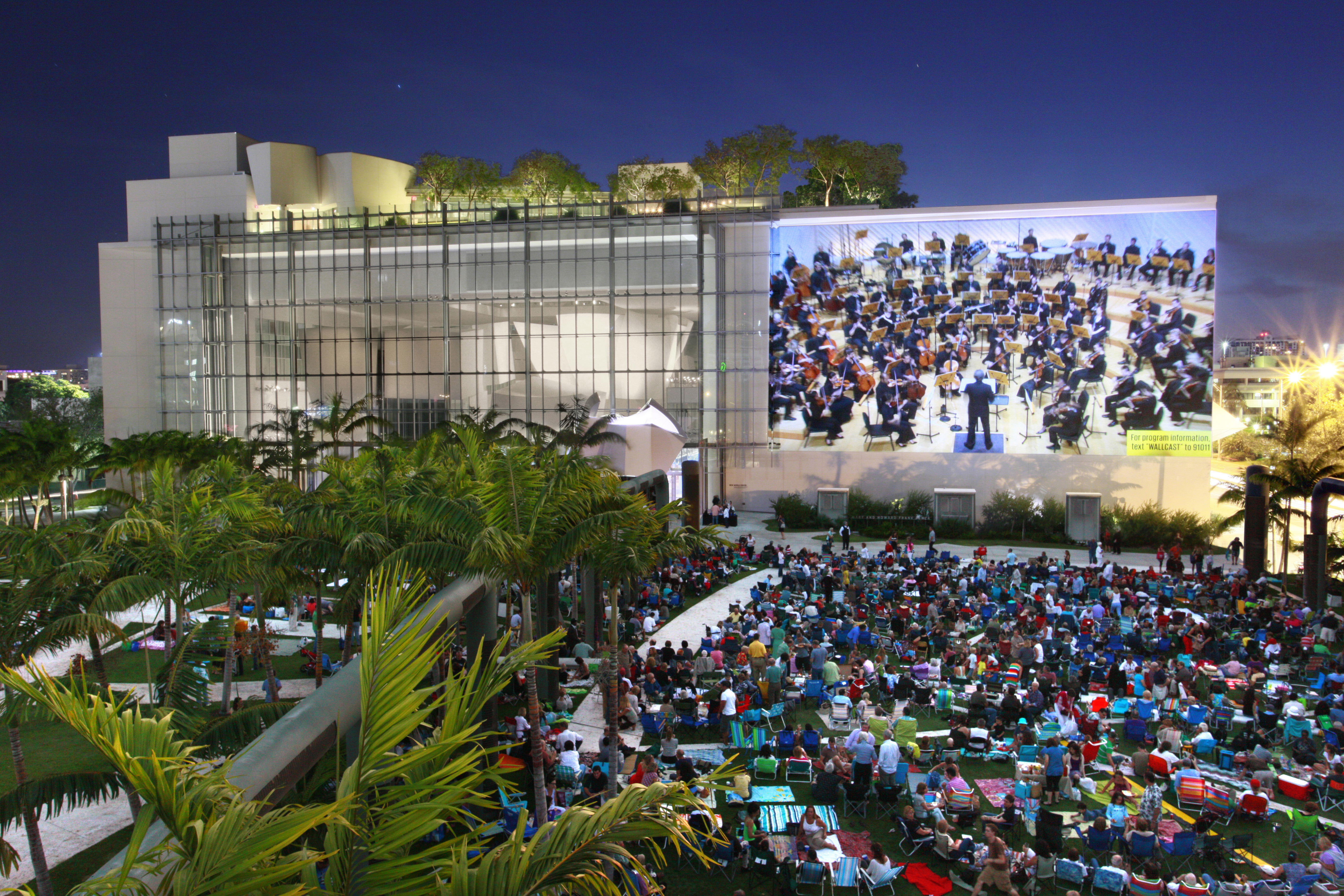 Crowds gather for the free outdoor wallcast concerts hosted by Miami Beach’s New World Symphony.