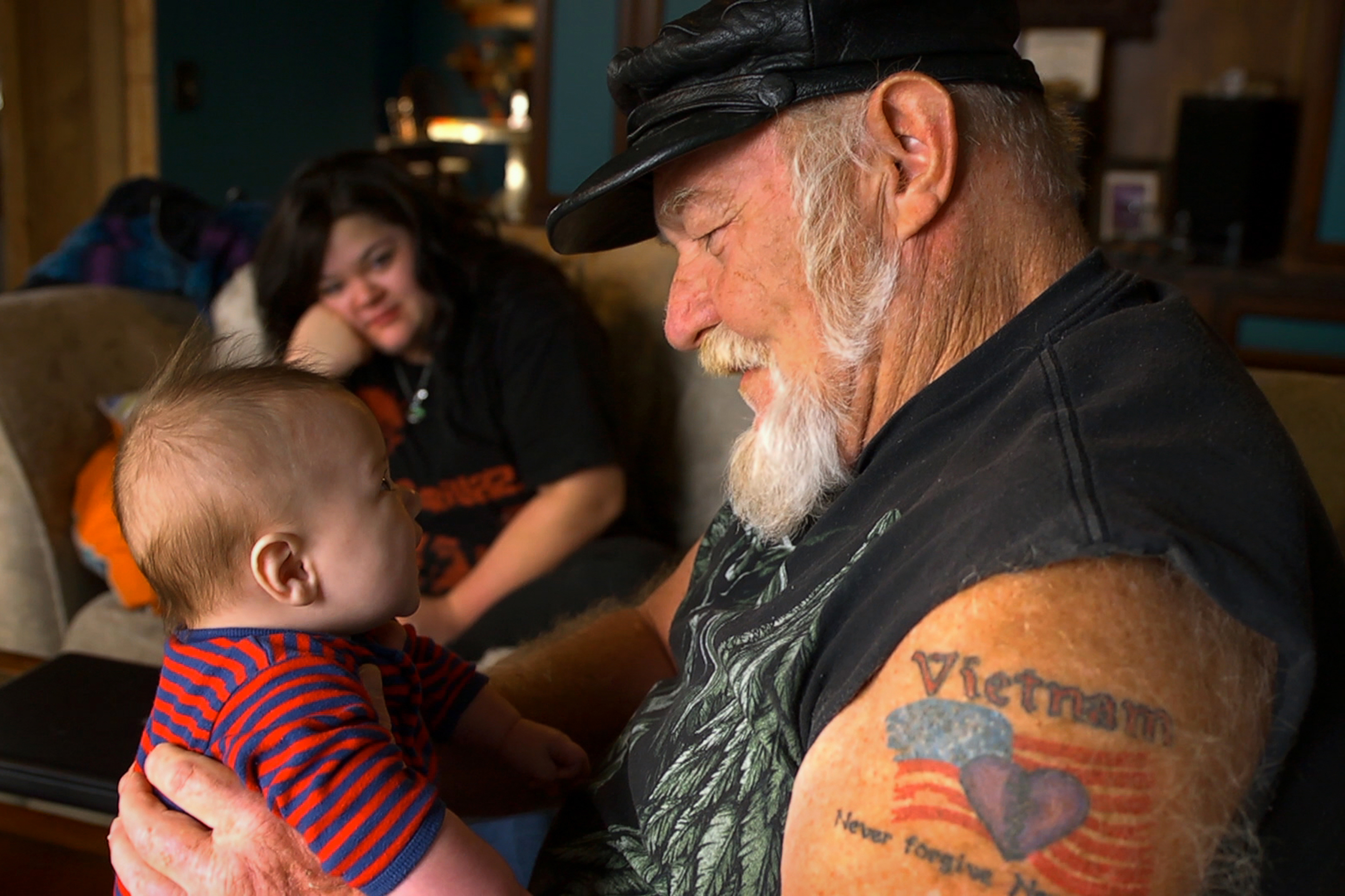 Ron “Stray Dog” Hall with his grandchild and daughter in “Stray Dog.”