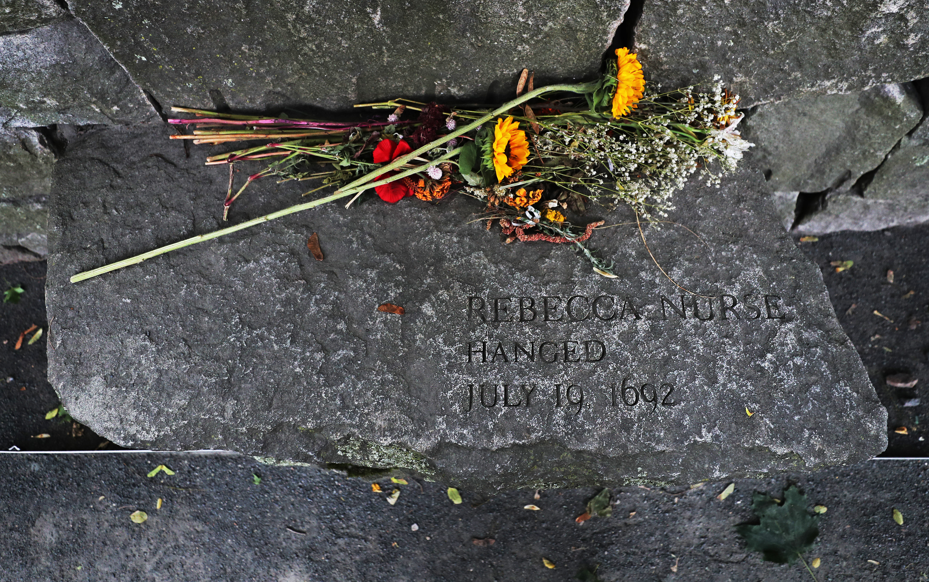 Flowers have been left at the memorial in Salem to Rebecca Nurse, who was executed for witchcraft.