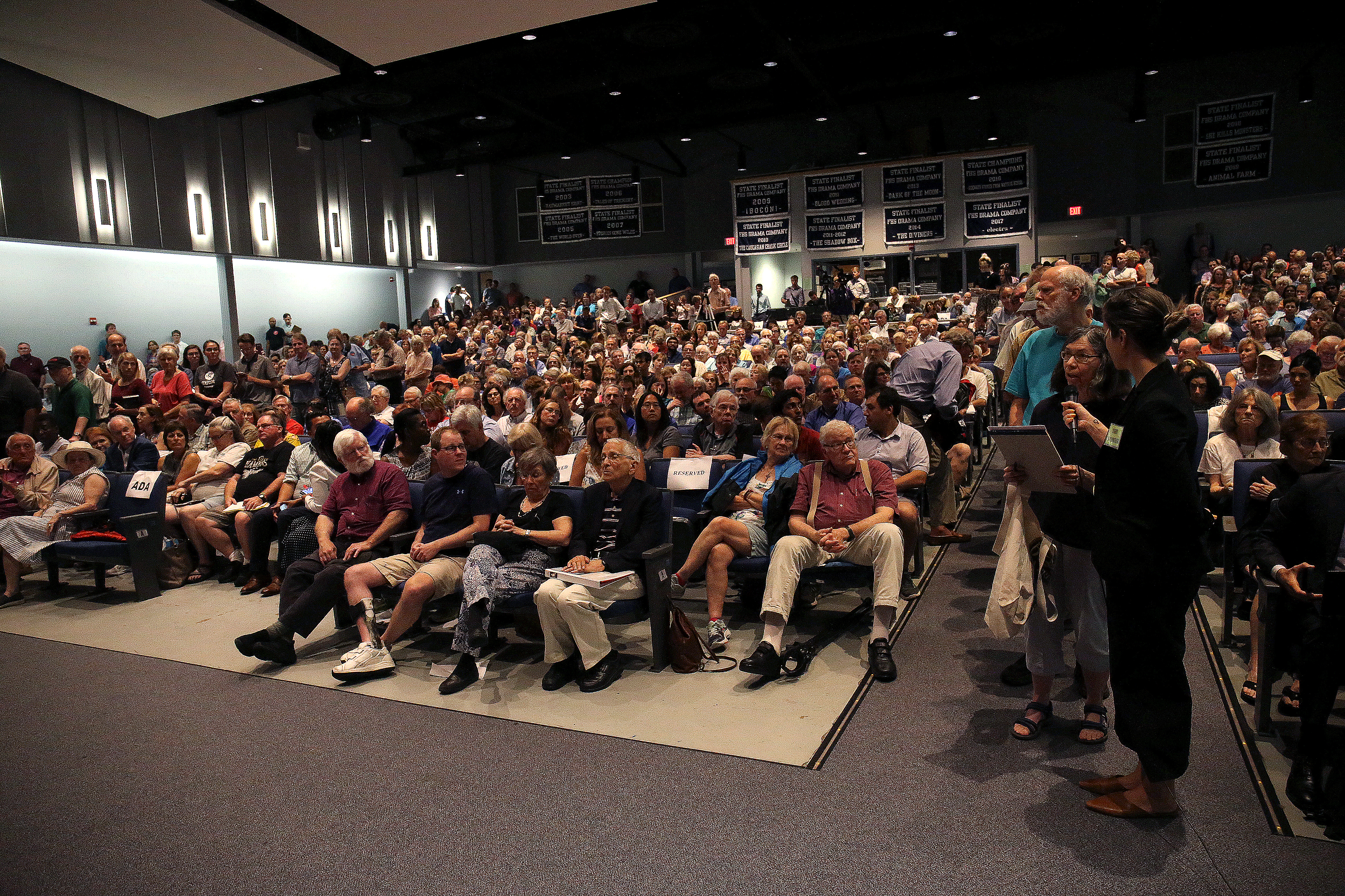 Attendees lined up for a Q &A with Markey and Clark at the high school.