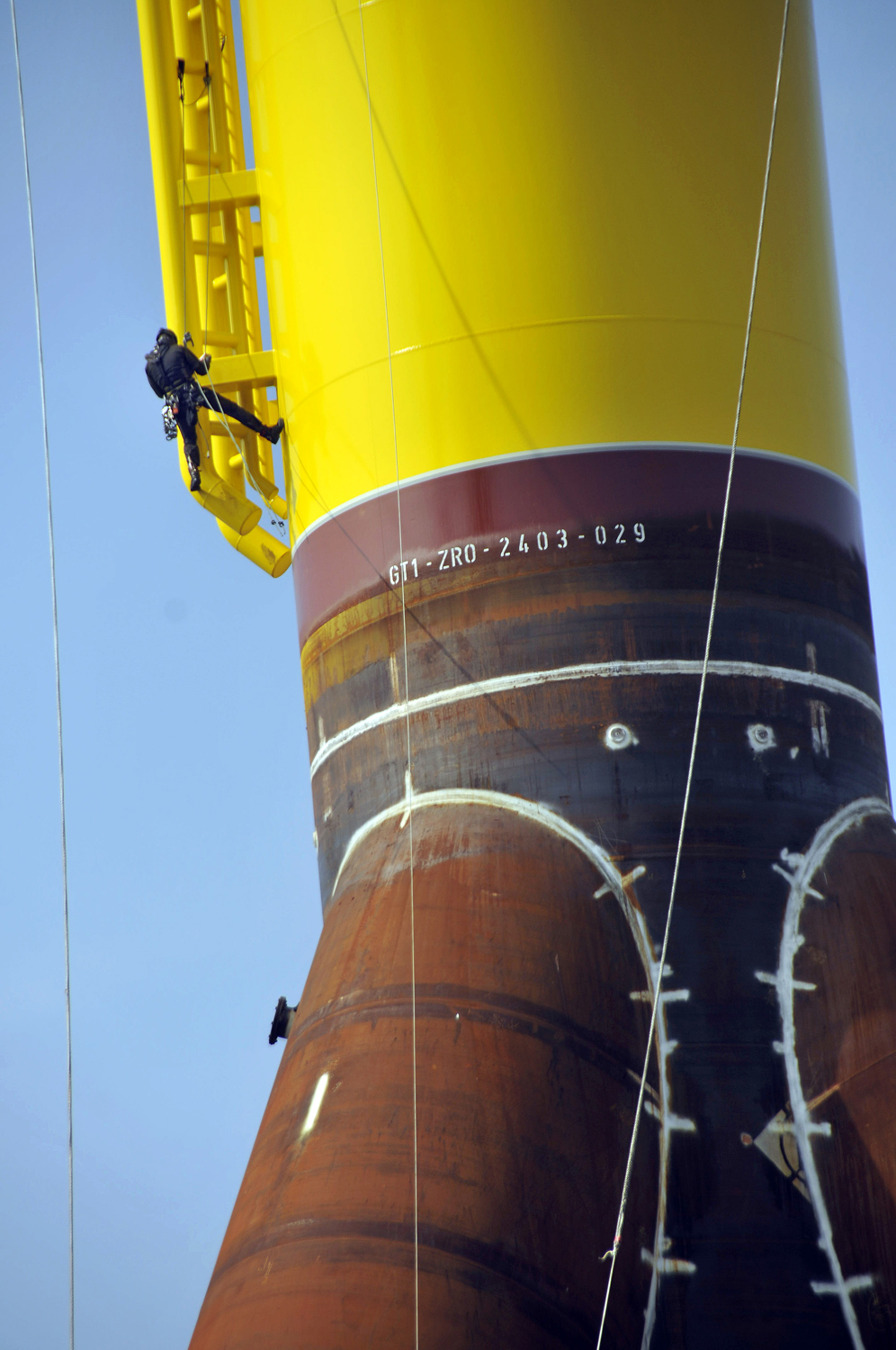 A turbine foundation in Bremerhaven dwarfed a worker.