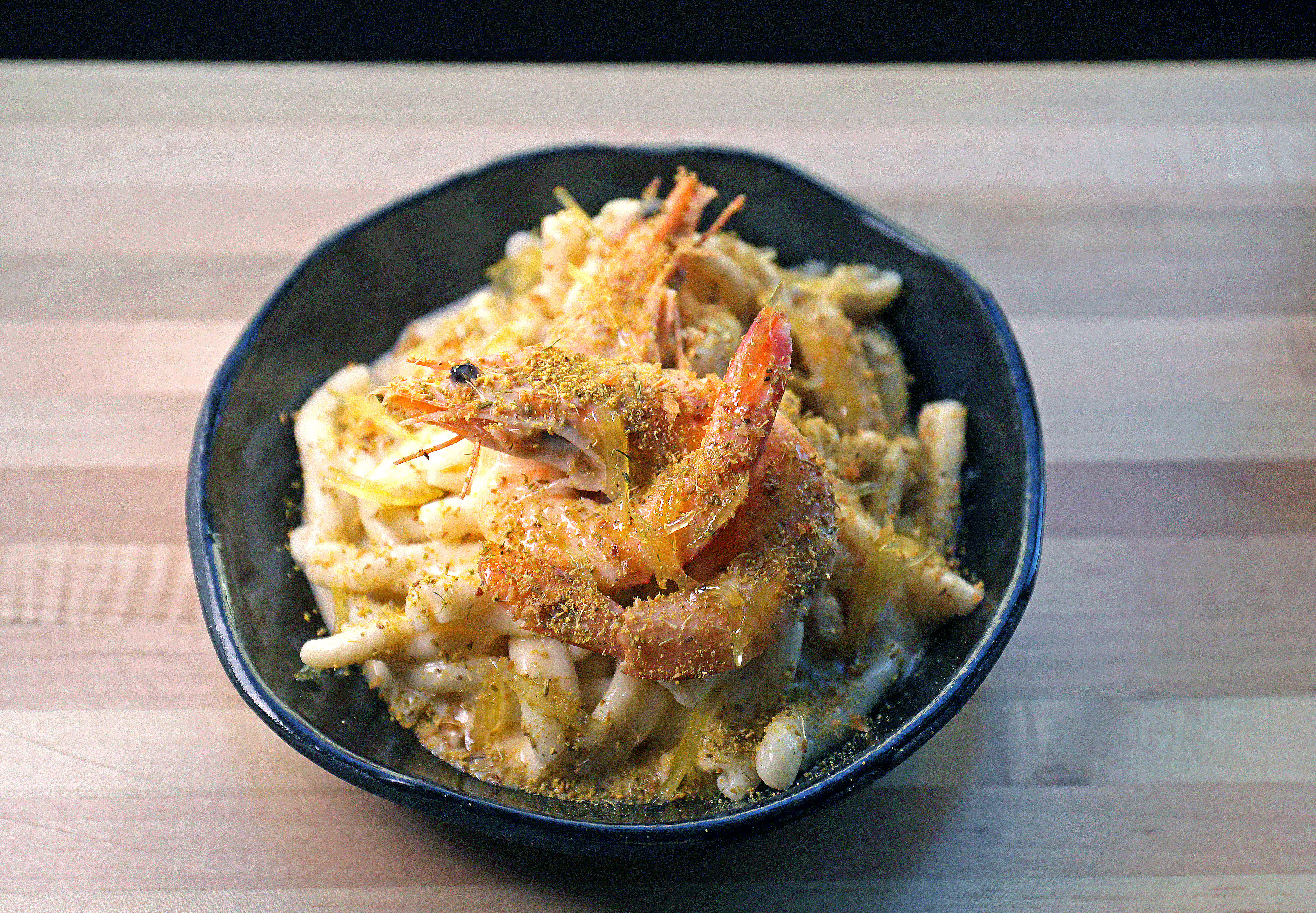 House-made casarecce with prawns, prawn butter, candied lemon, and fennel pollen.