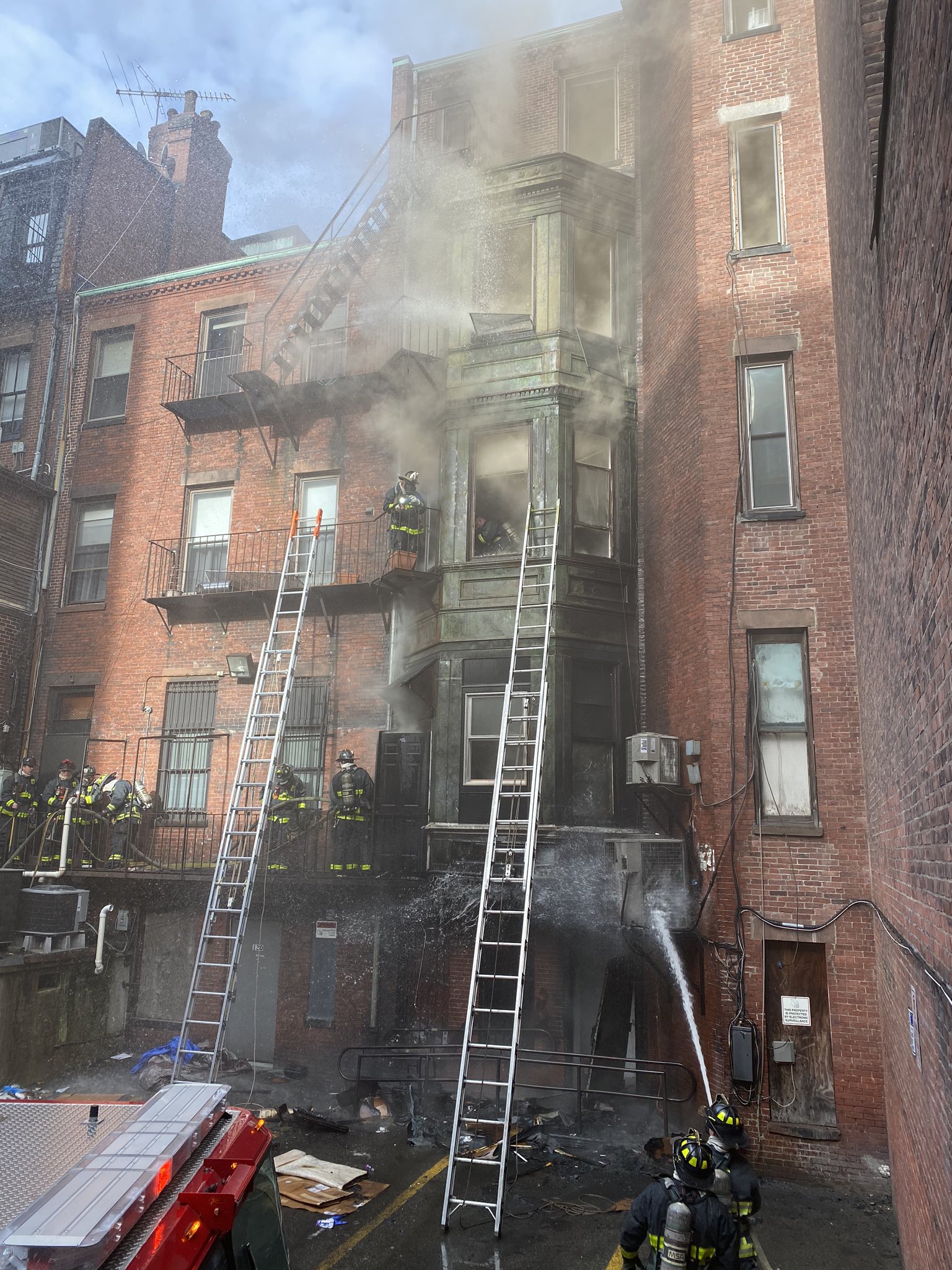 Boston firefighters worked to extinguish a fire on Newbury Street Christmas morning.