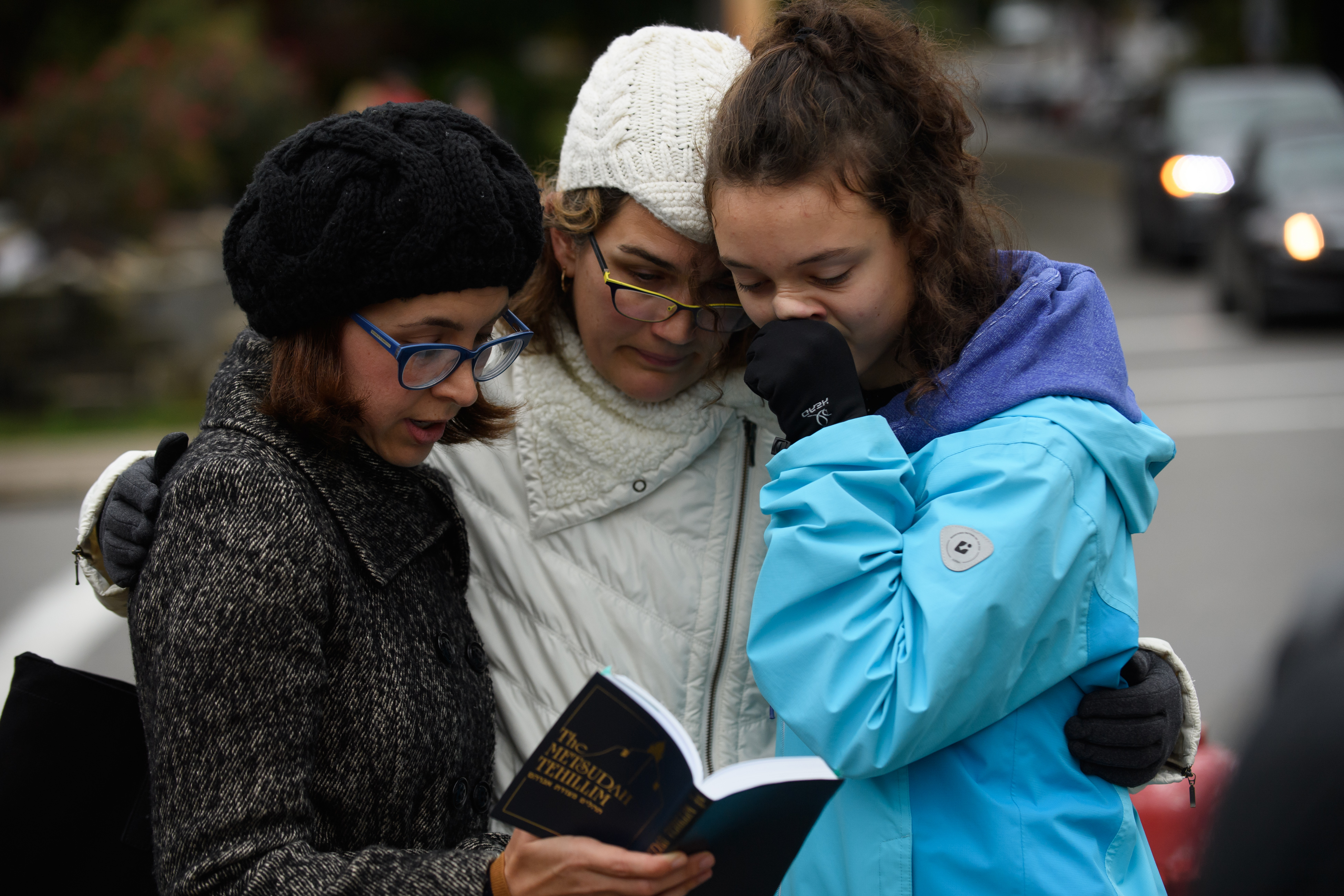 Tammy Hepps, Kate Rothstein, and her daughter, Simone Rothstein, 16, prayed a block away from the site of Saturday’s deadly shooting in Pittsburgh.