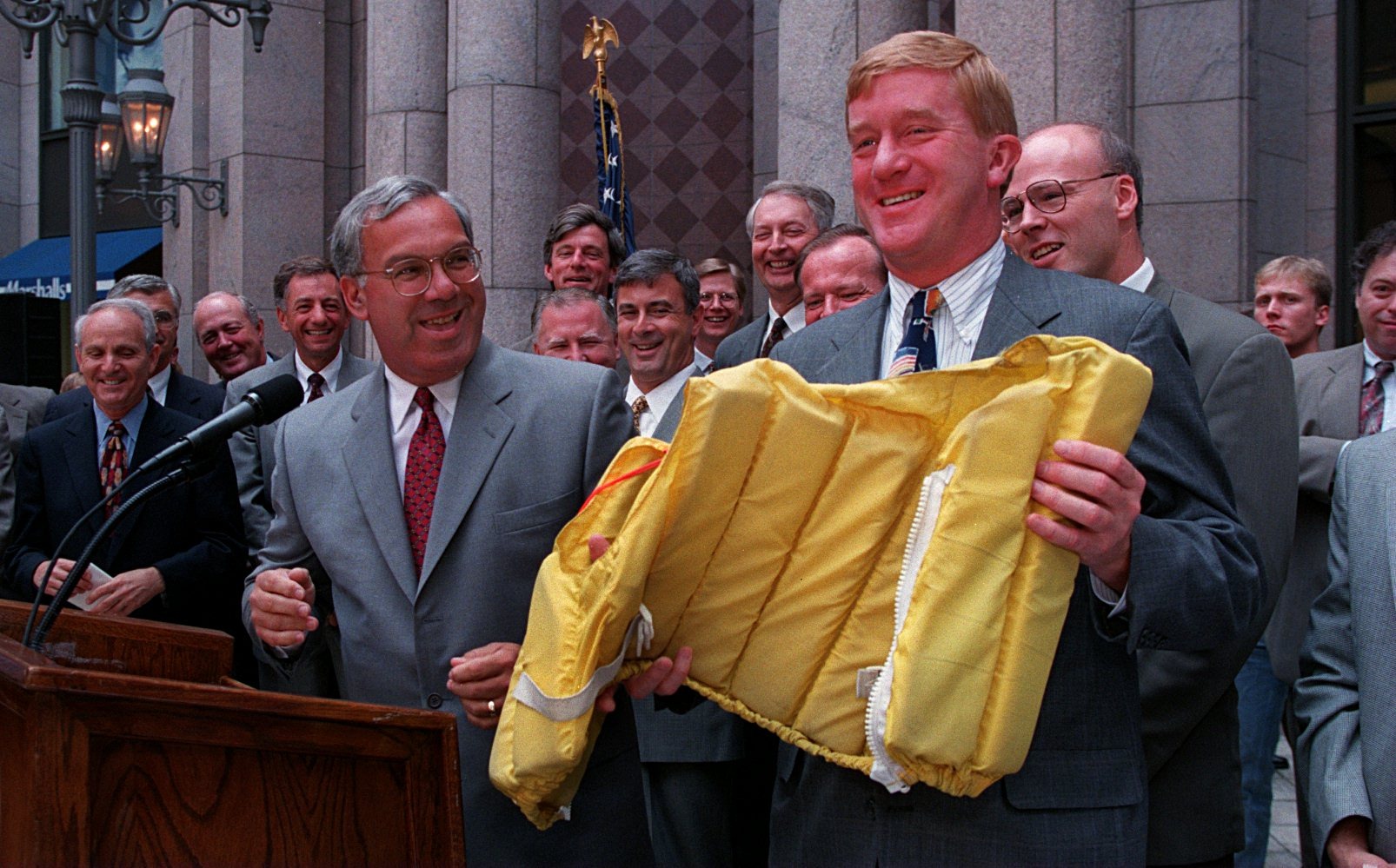 Boston Mayor Thomas M. Menino gave a life jacket to Weld before the Mutual Fund Tax Bill Cut signing in 1996.