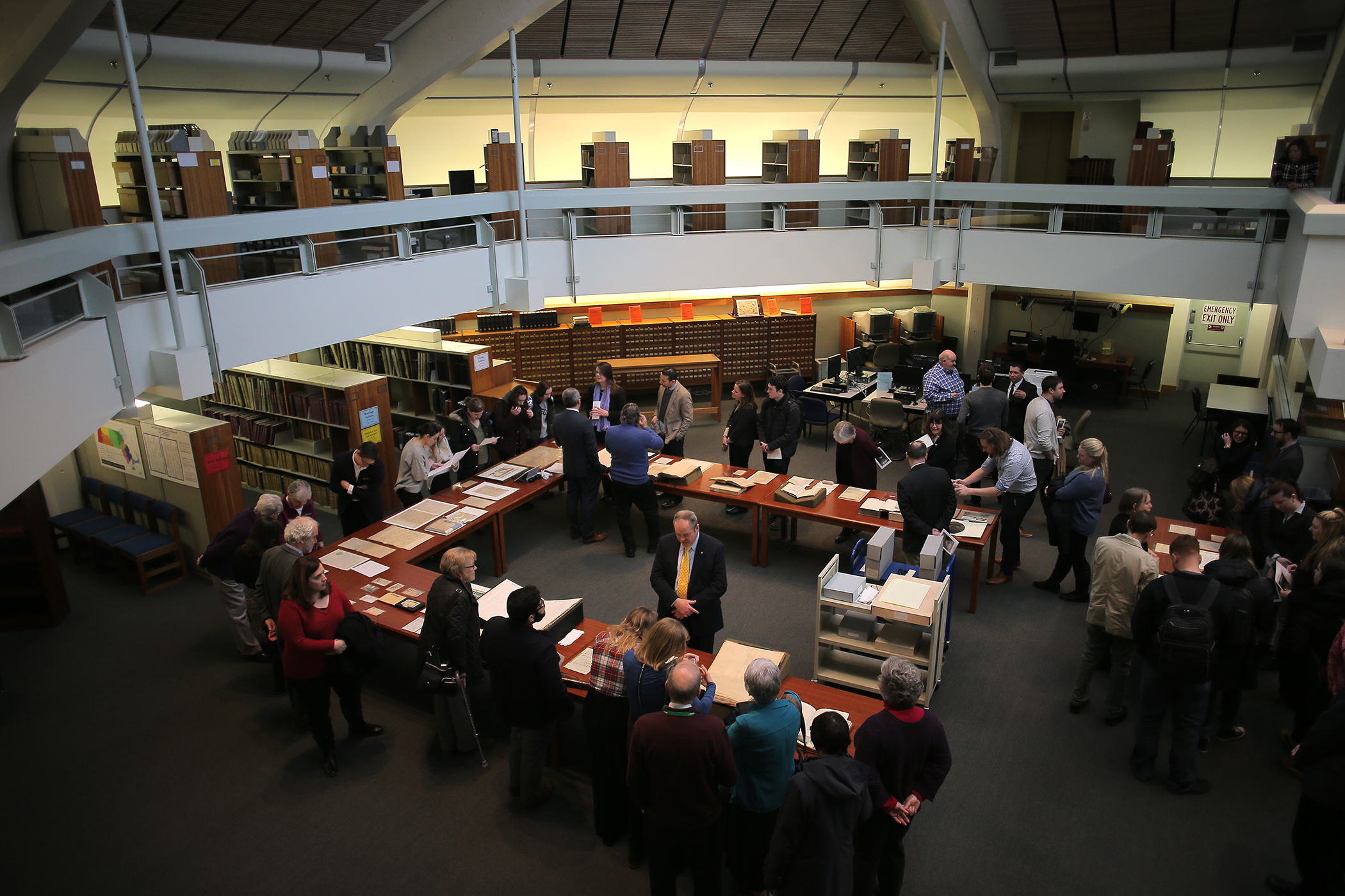 Guests visited with archival items during the opening celebration.
