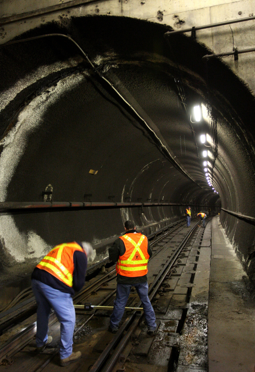 MBTA workers checked Red Line tracks at Davis station after leaks were discovered in the tunnel ceiling.