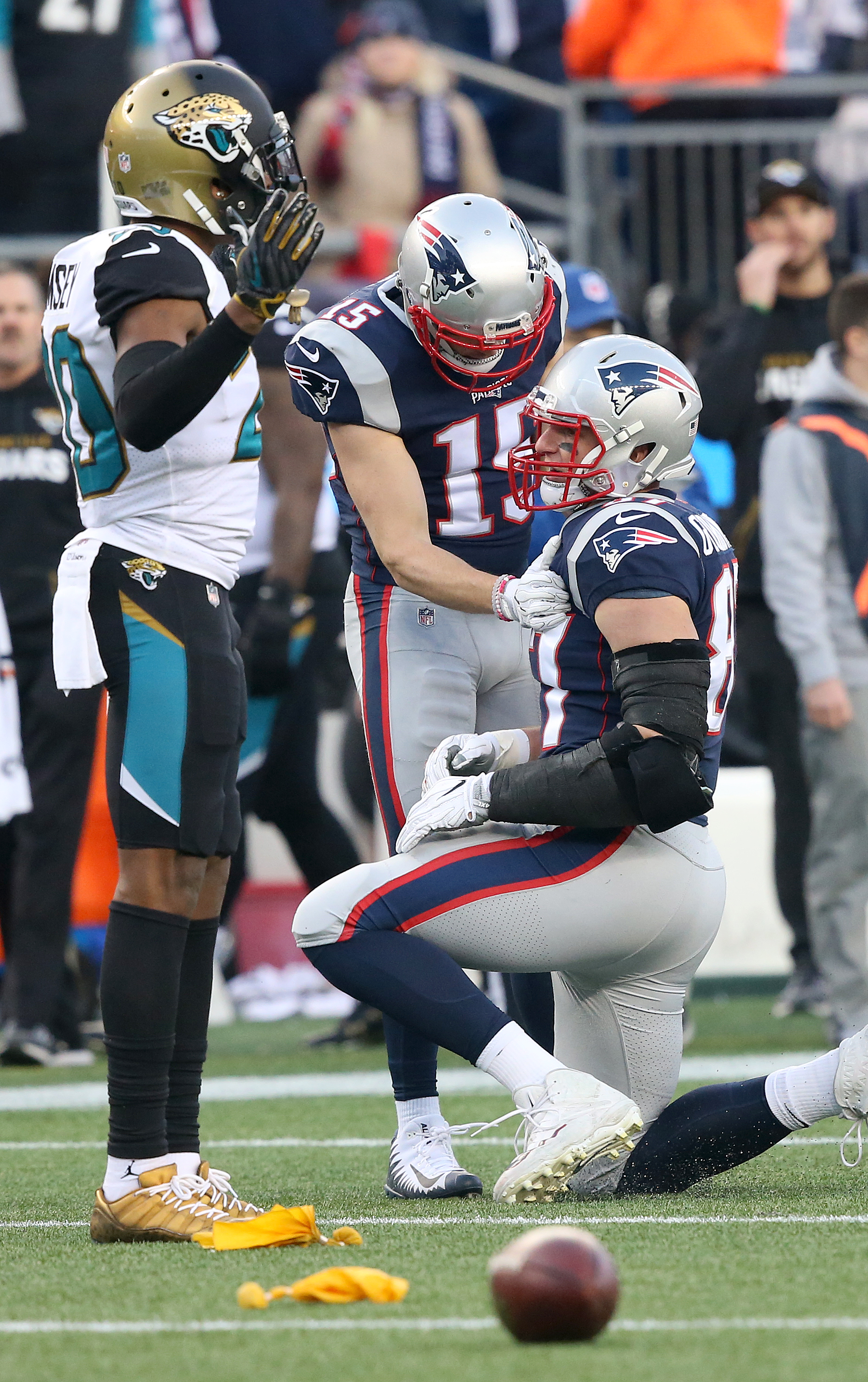 Chris Hogan checks on Gronkowski after the hit.