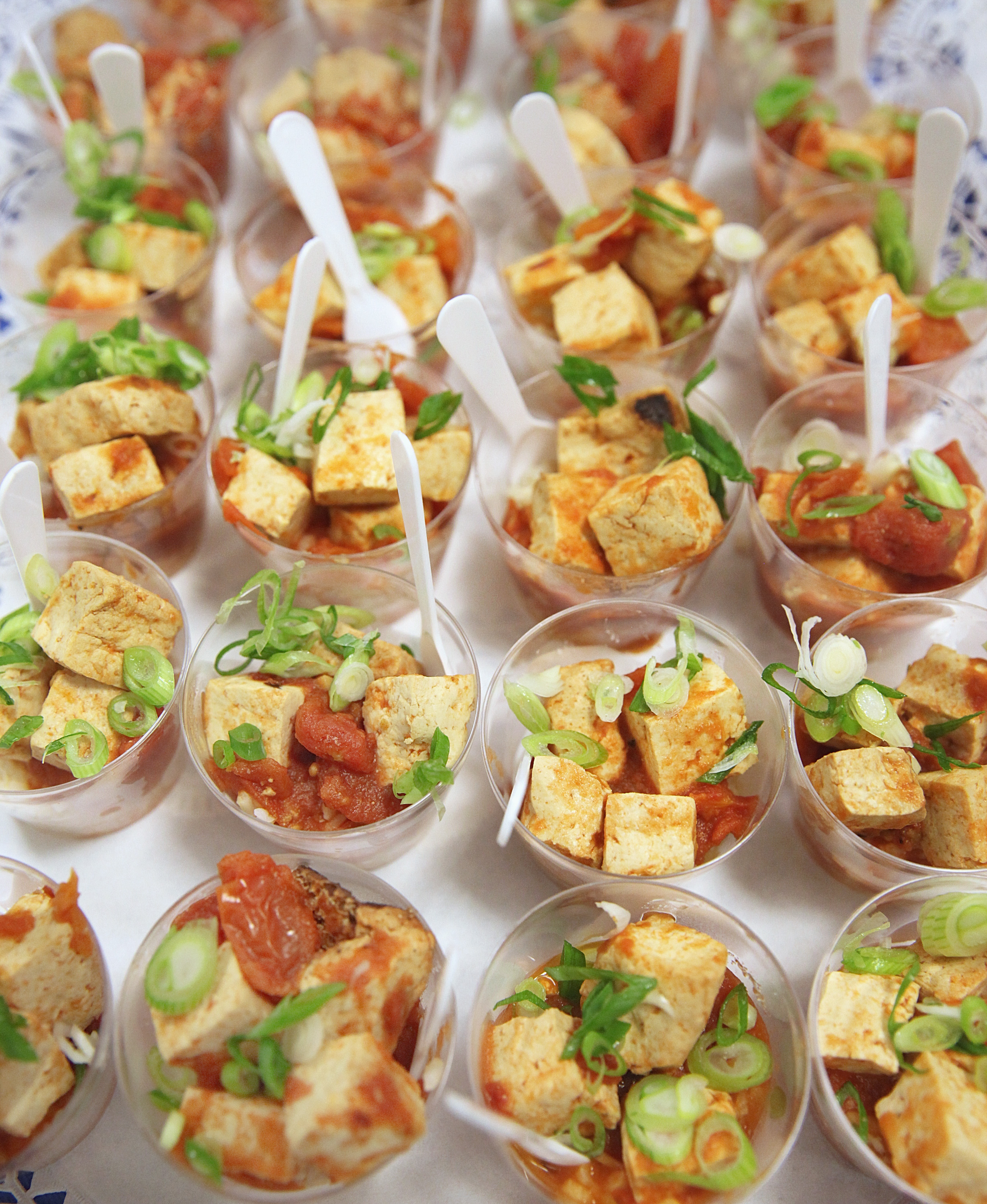 A stir-fried tofu and tomato dish.