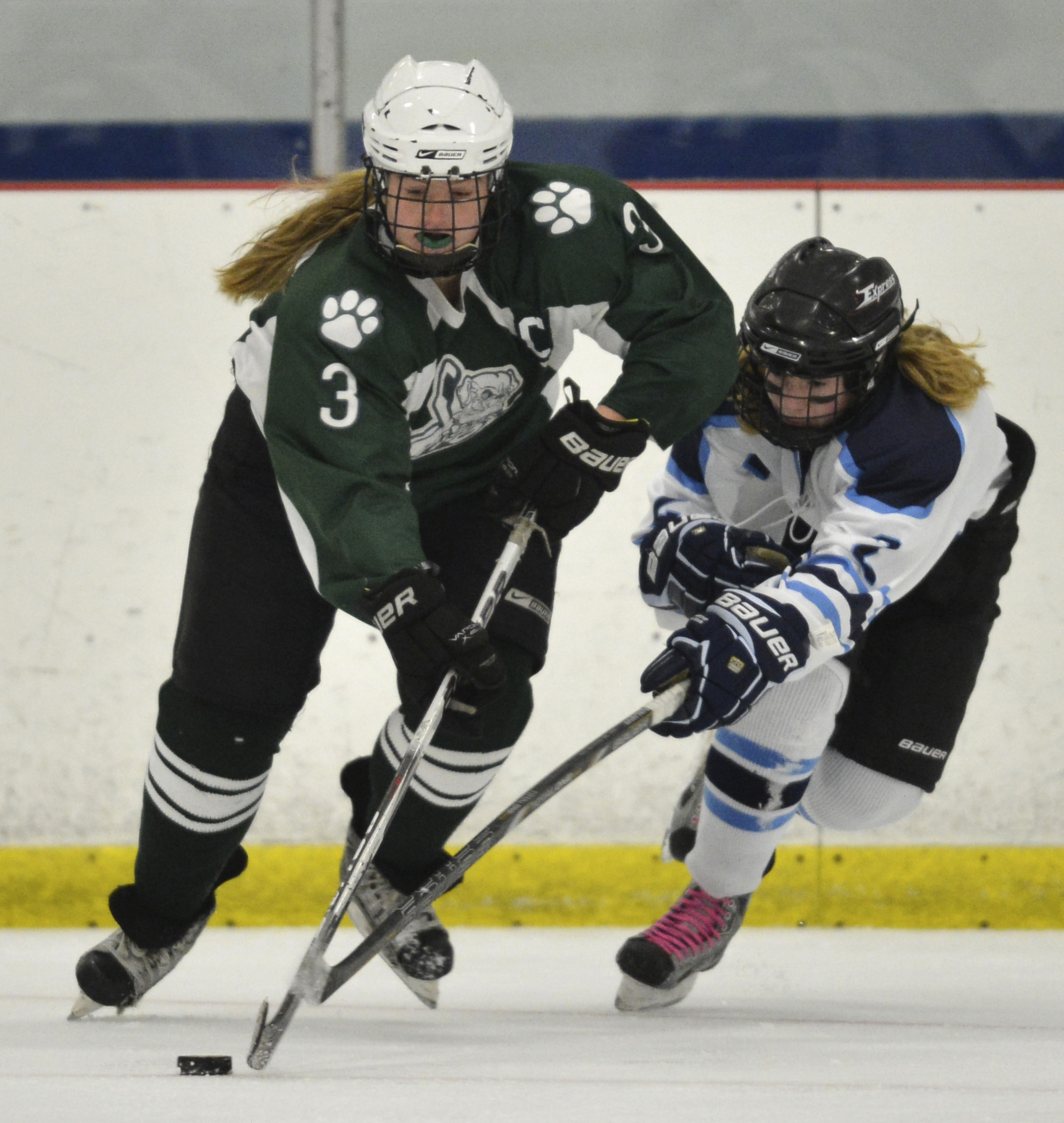 Canton center Meaghan McKenna skates with the puck past a defender during Saturday’s decisive 7-2 win over Medfield.