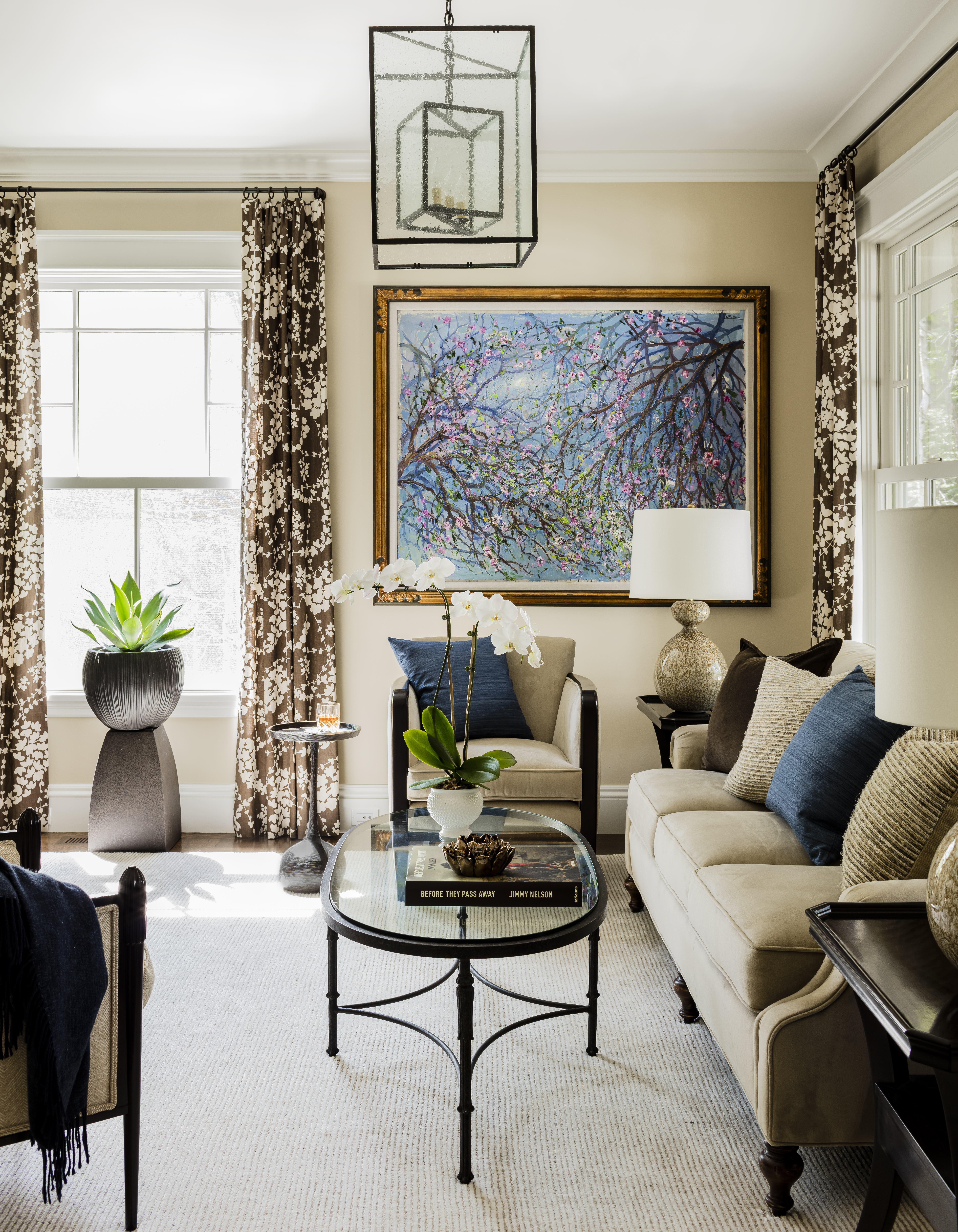 The family visited galleries and the Boston Design Center to shop for art. One of the girls’ favorite paintings, by Bruno Zupan, hangs in the living room, above a slim-profile Barbara Barry chair and cast-bronze martini table. The sofa is by Wesley Hall, and drapes are in a linen fabric by Quadrille.