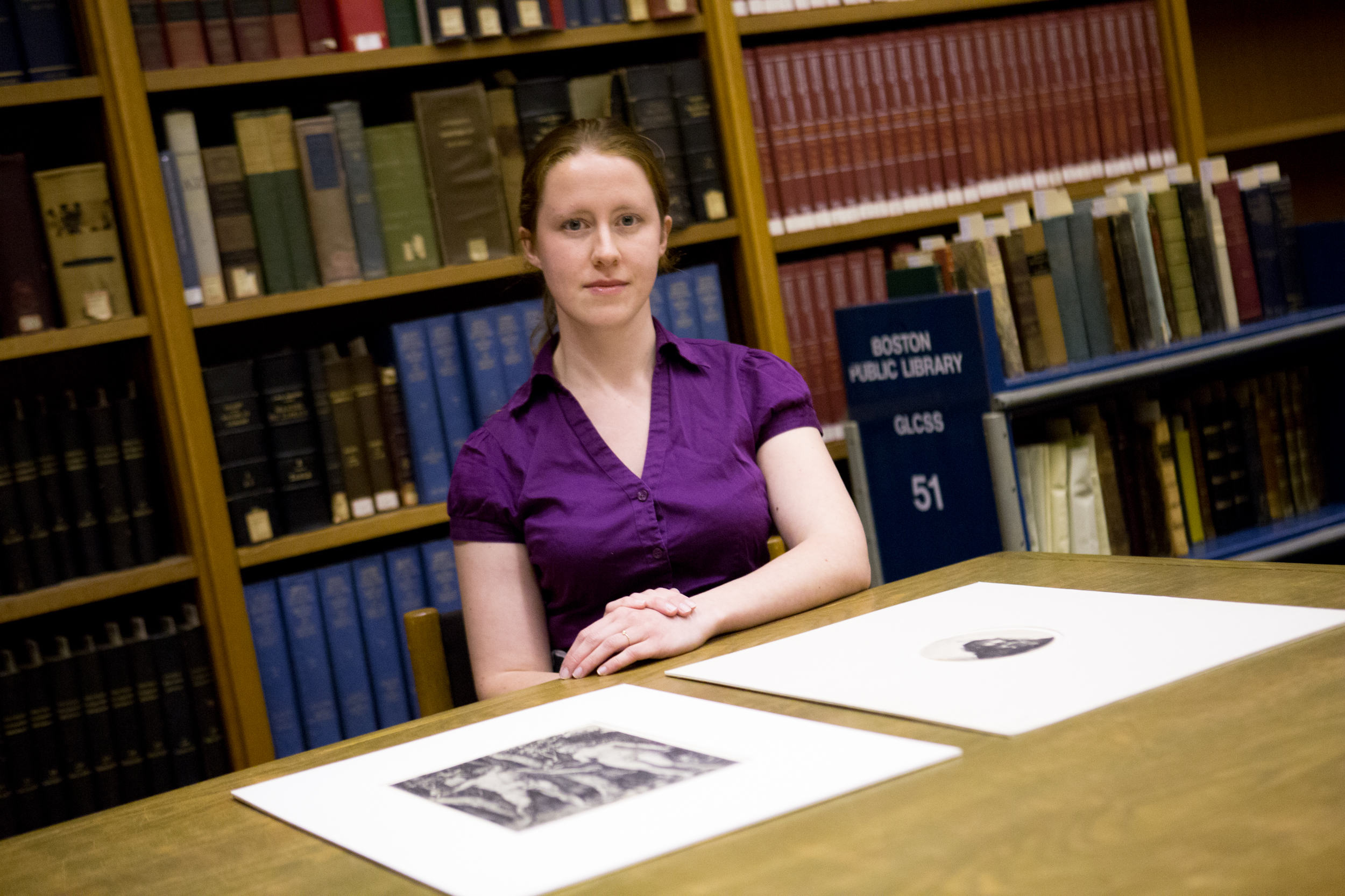 Lauren Schott with the prints she found.