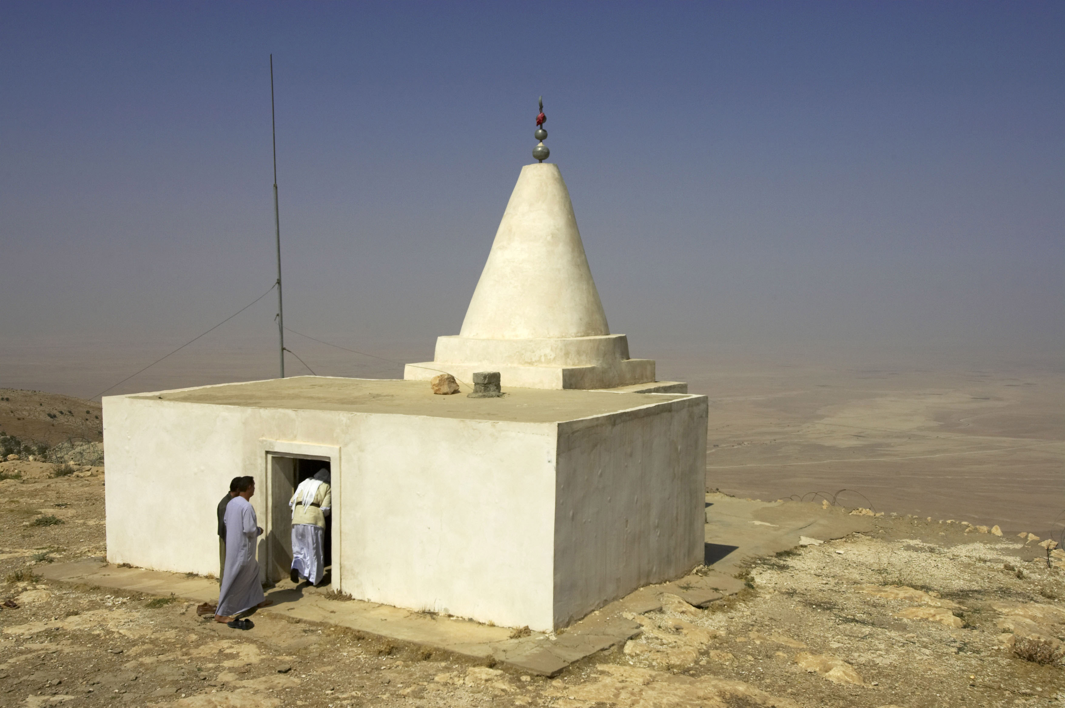 Yazidi men enter a shrine at the top of Mount Sinjar, northwest of Baghdad.