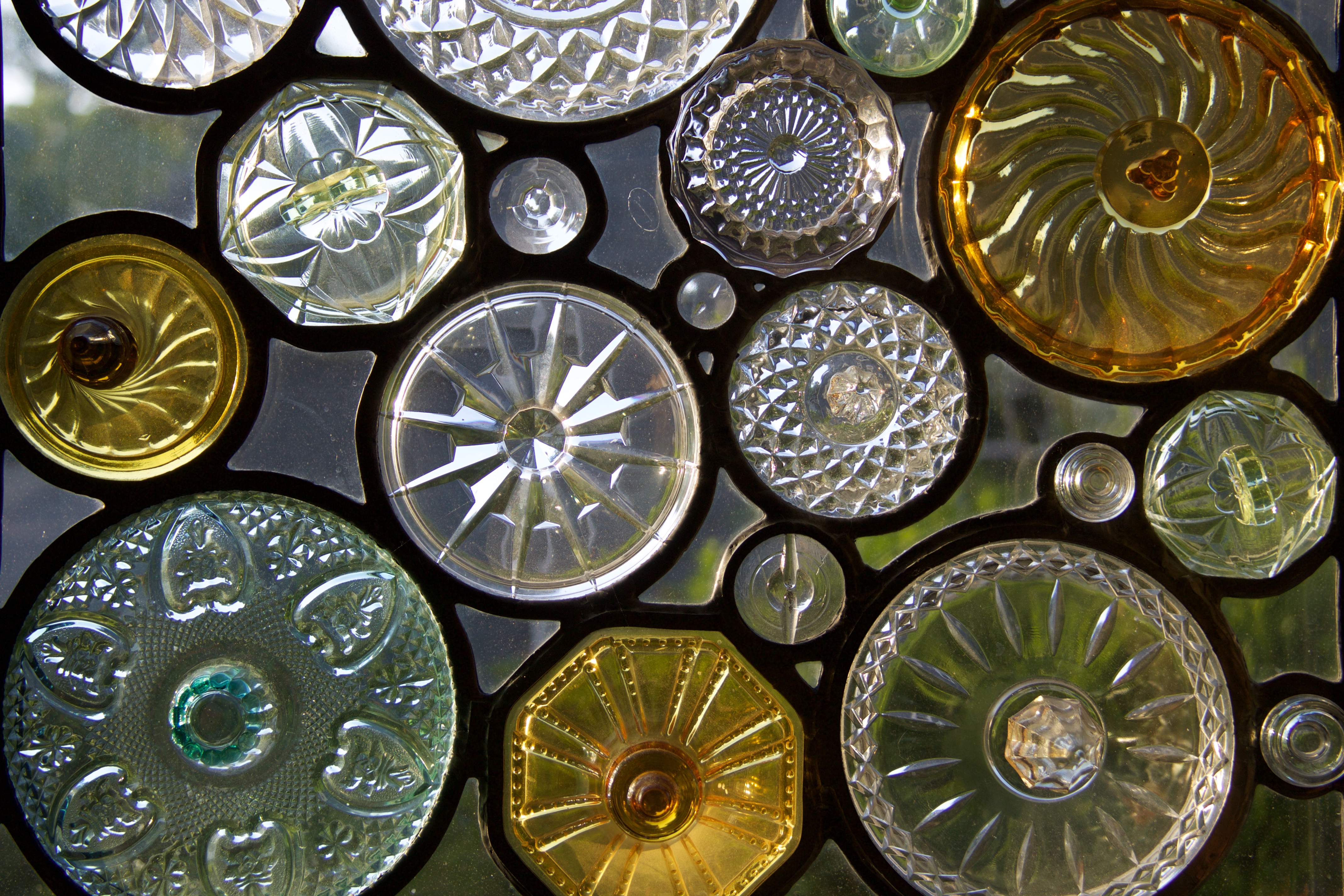 A stained-glass window made from Depression-era candy jar lids. It was designed and fabricated by artist Dan Maher.