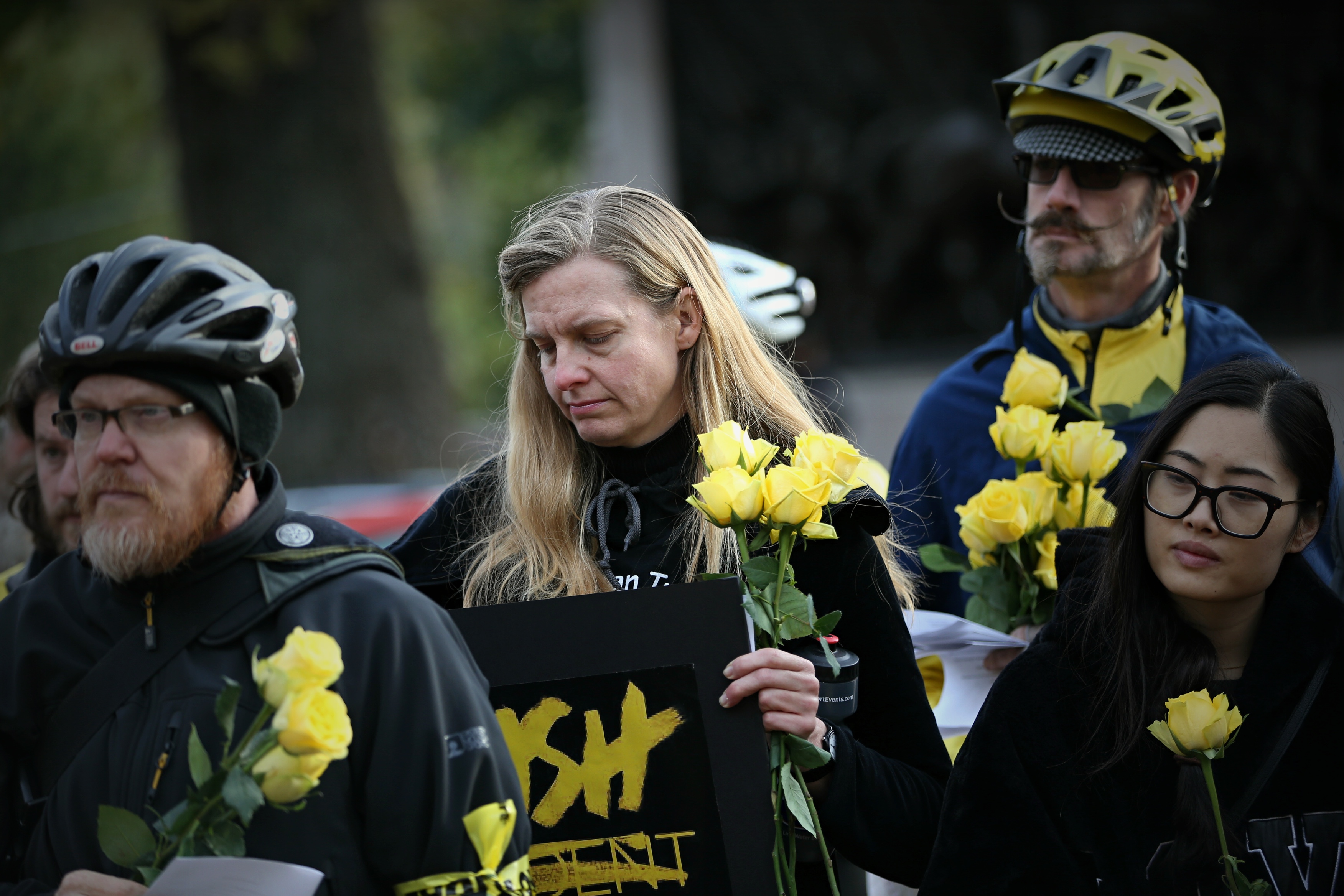 Participants at the rally on Sunday held flowers in remembrance of those killed in car crashes.