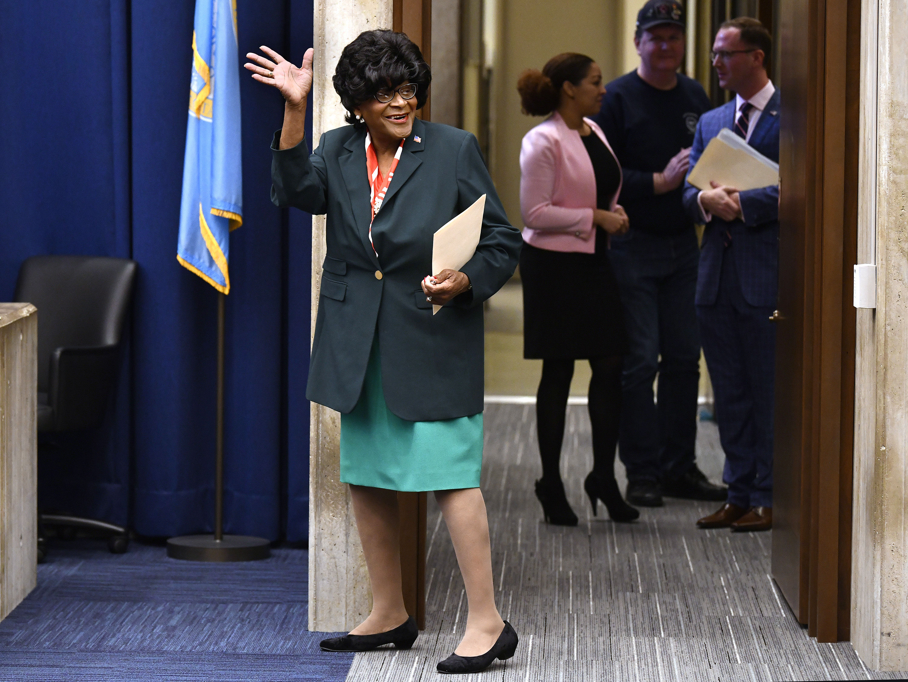 Althea Garrison waved to the City Council chamber.