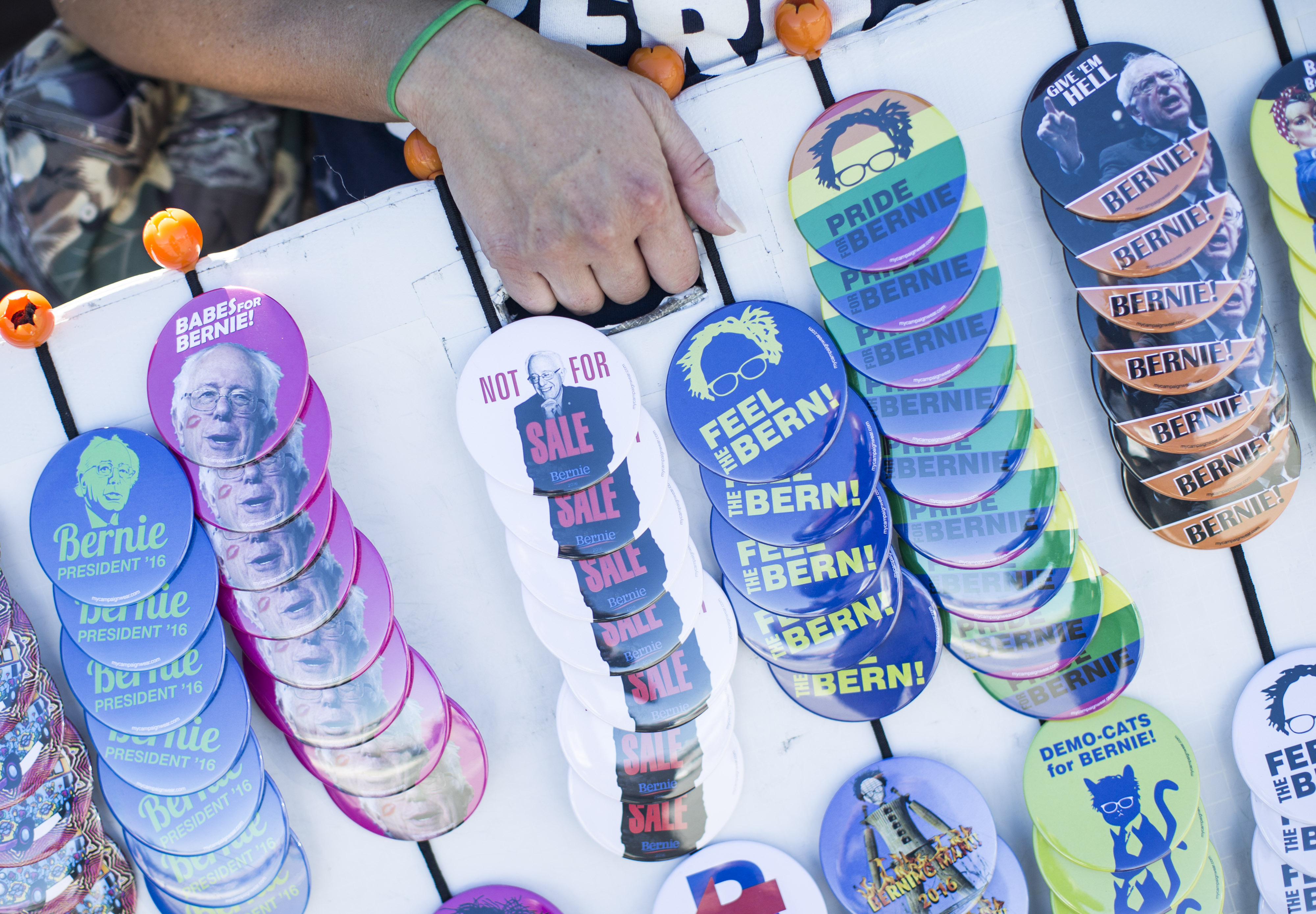 A vendor sold Bernie Sanders buttons in front of a town hall meeting in Seabrook, New Hampshire.