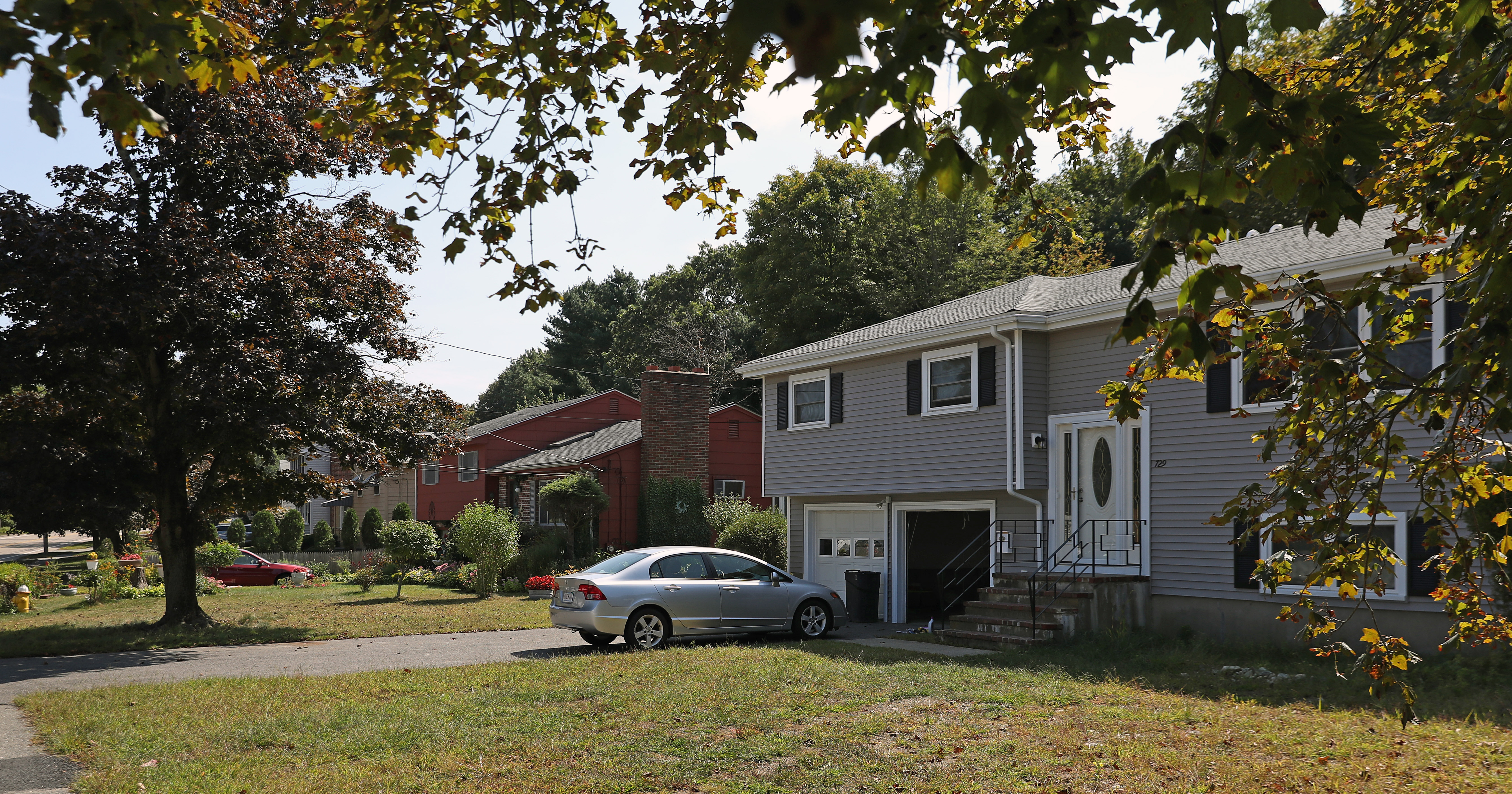 Across the street from the 136-unit development on Greendale Avenue in Needham is a neighborhood of single-family homes.