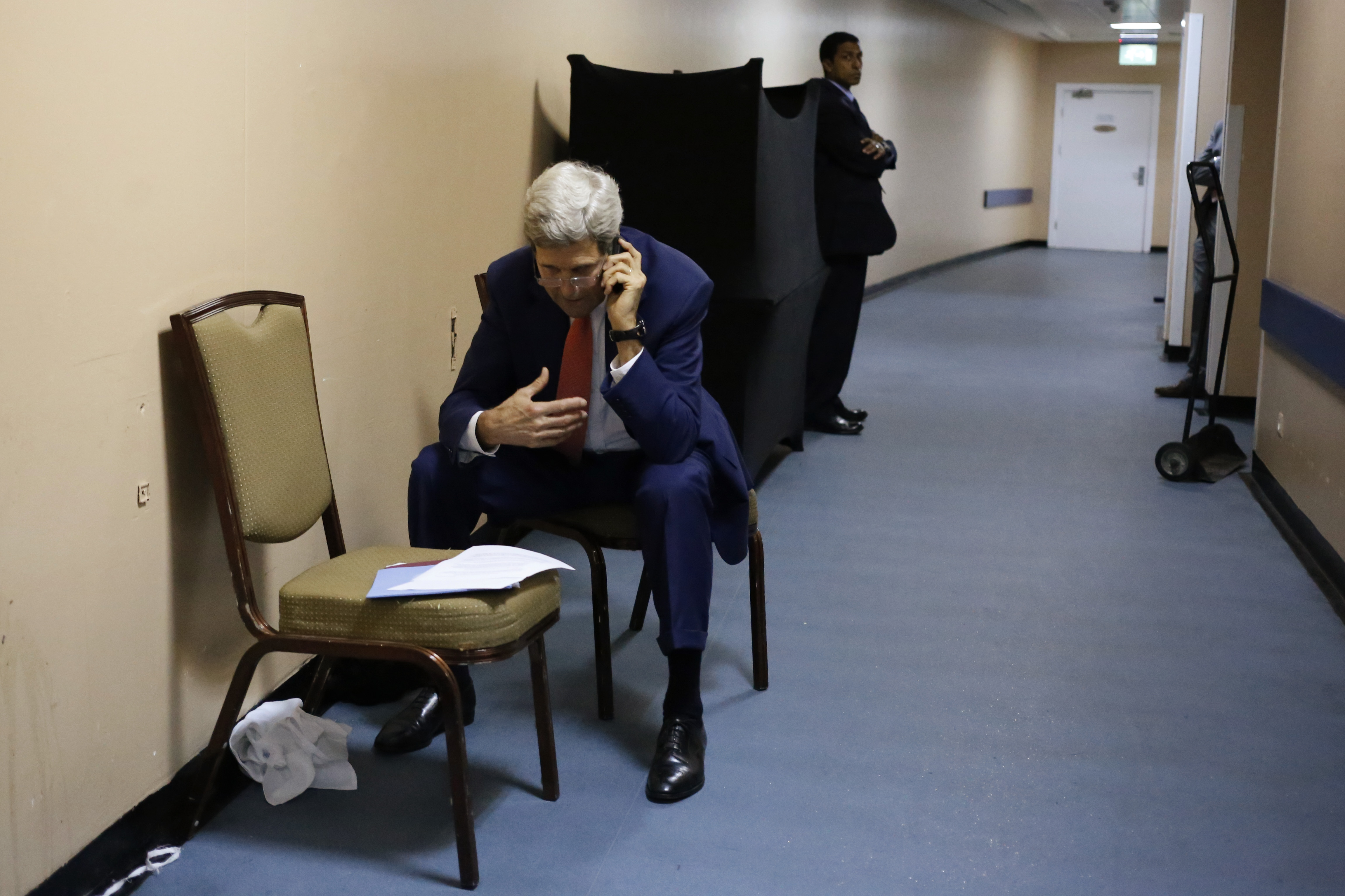 US Secretary of State John Kerry sat in a service hallway of a hotel in Cairo, Egypt, on July 25, as he spoke with Qatar’s Foreign Minister Khaled al-Attiyah on the phone. The two discussed terms of a cease-fire in fighting in Gaza.