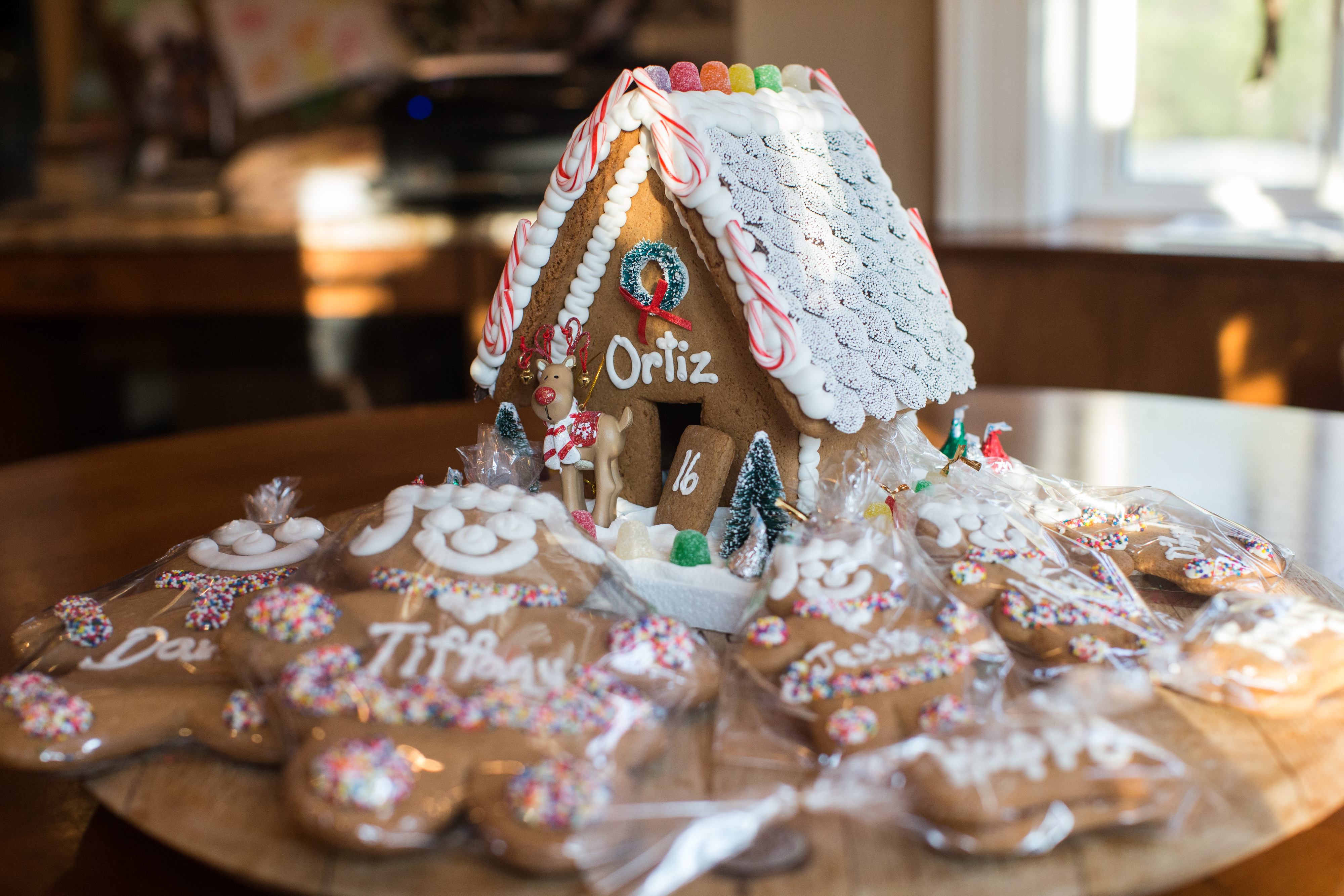 A Christmas gingerbread house sits on a table at the Ortiz home.
