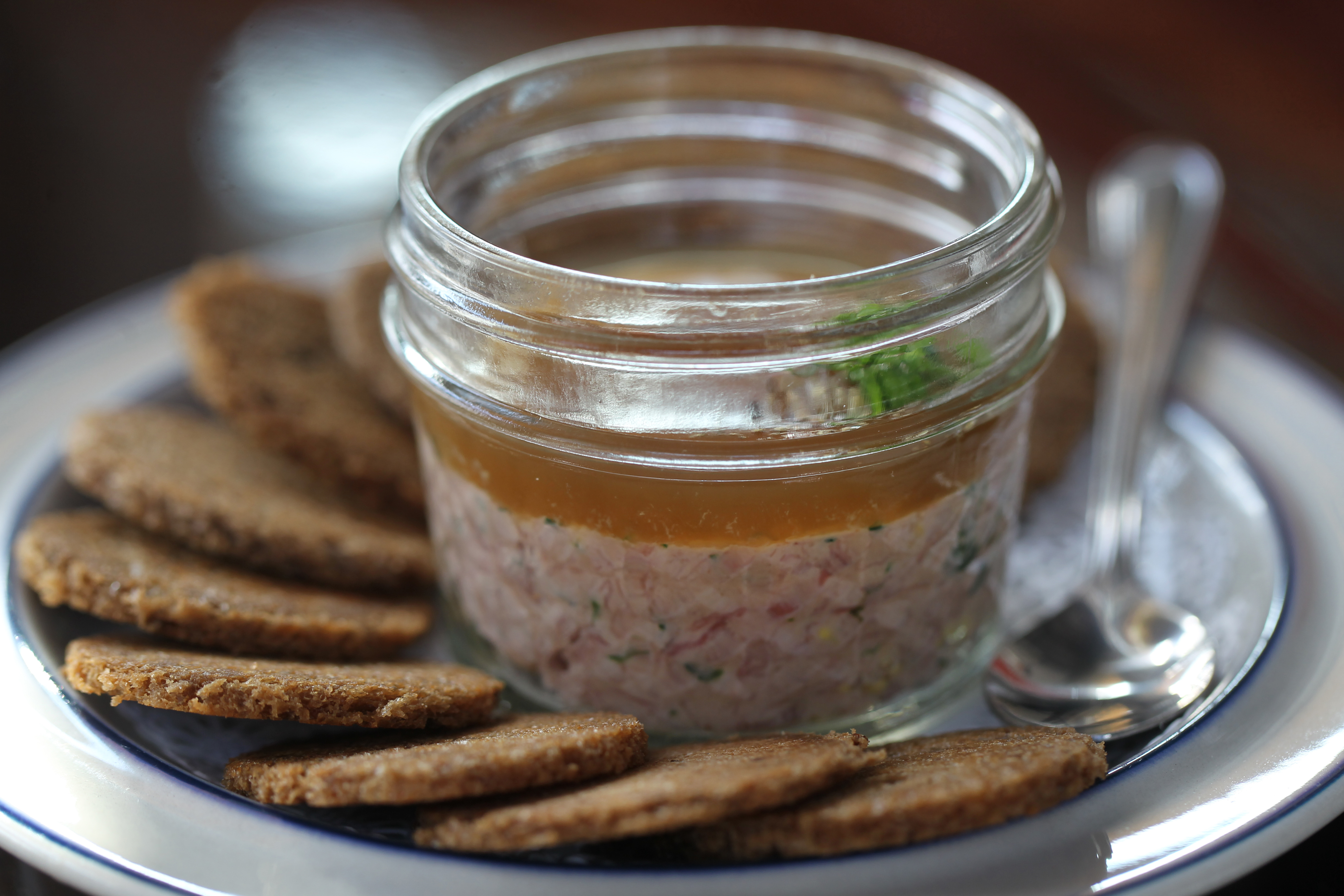 Ham salad served with discs of homemade pumpernickel.