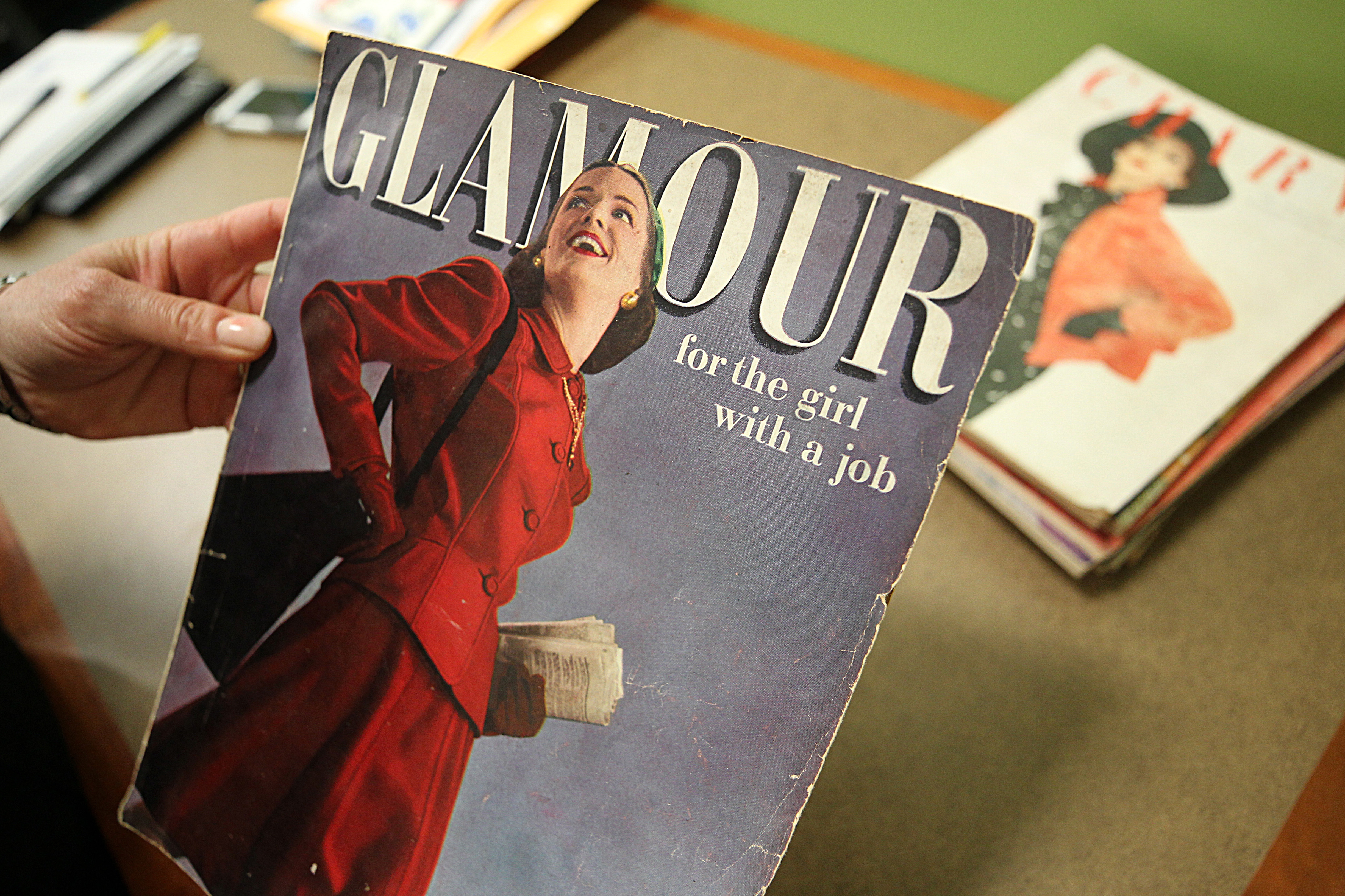 Lining the walls are posters from other past events featuring quotes and magazine covers about working women from the 1940s and ’50s.