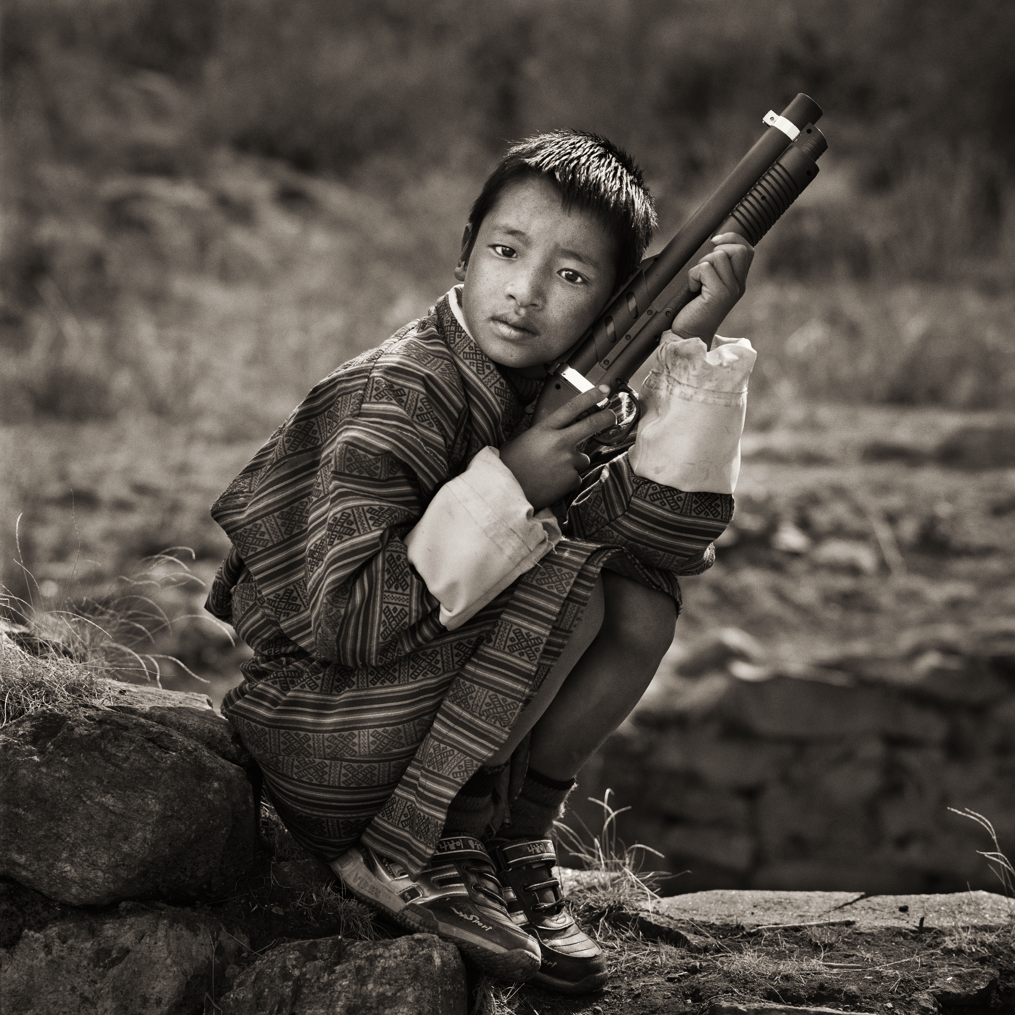 Dana Gluckstein’s “Young Boy at Religious Festival, Bhutan, 2010.”