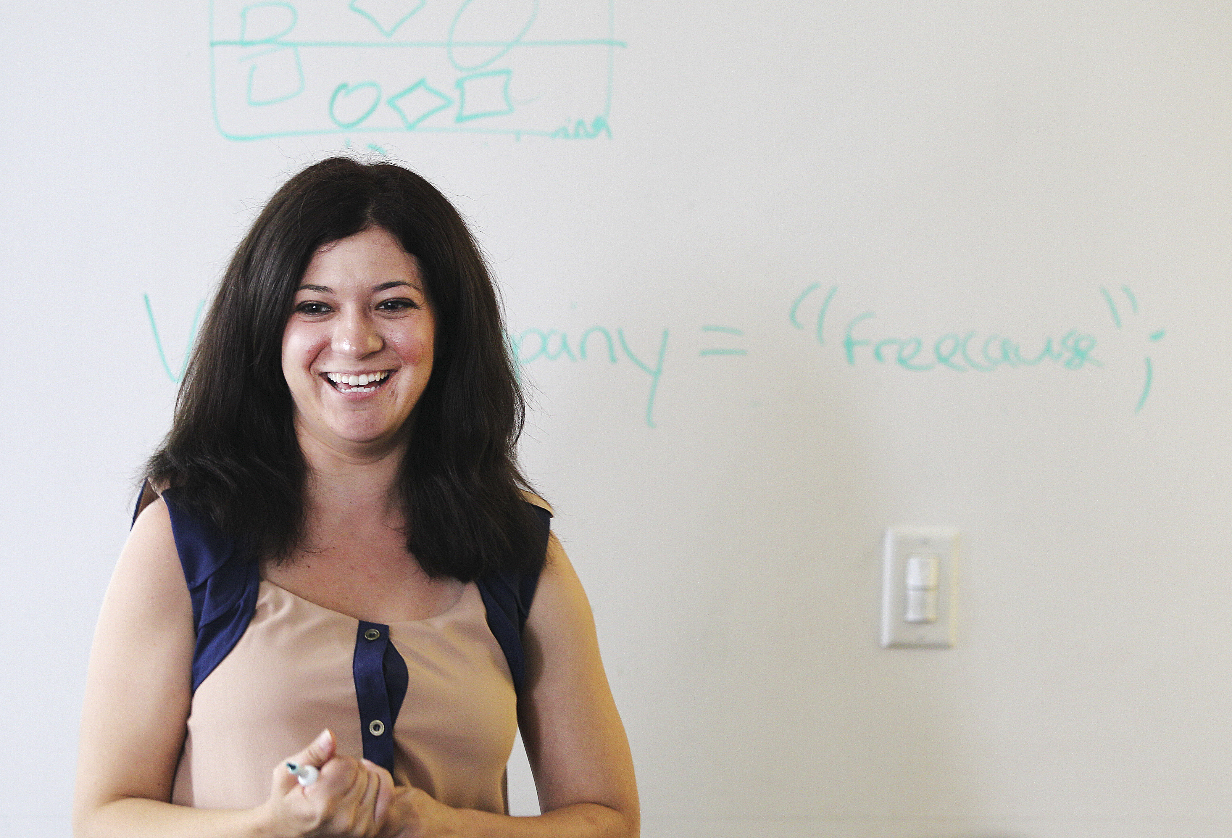 Elizabeth Goncalves, marketing manager, beamed after declaring a string variable on the board during a JavaScript class.