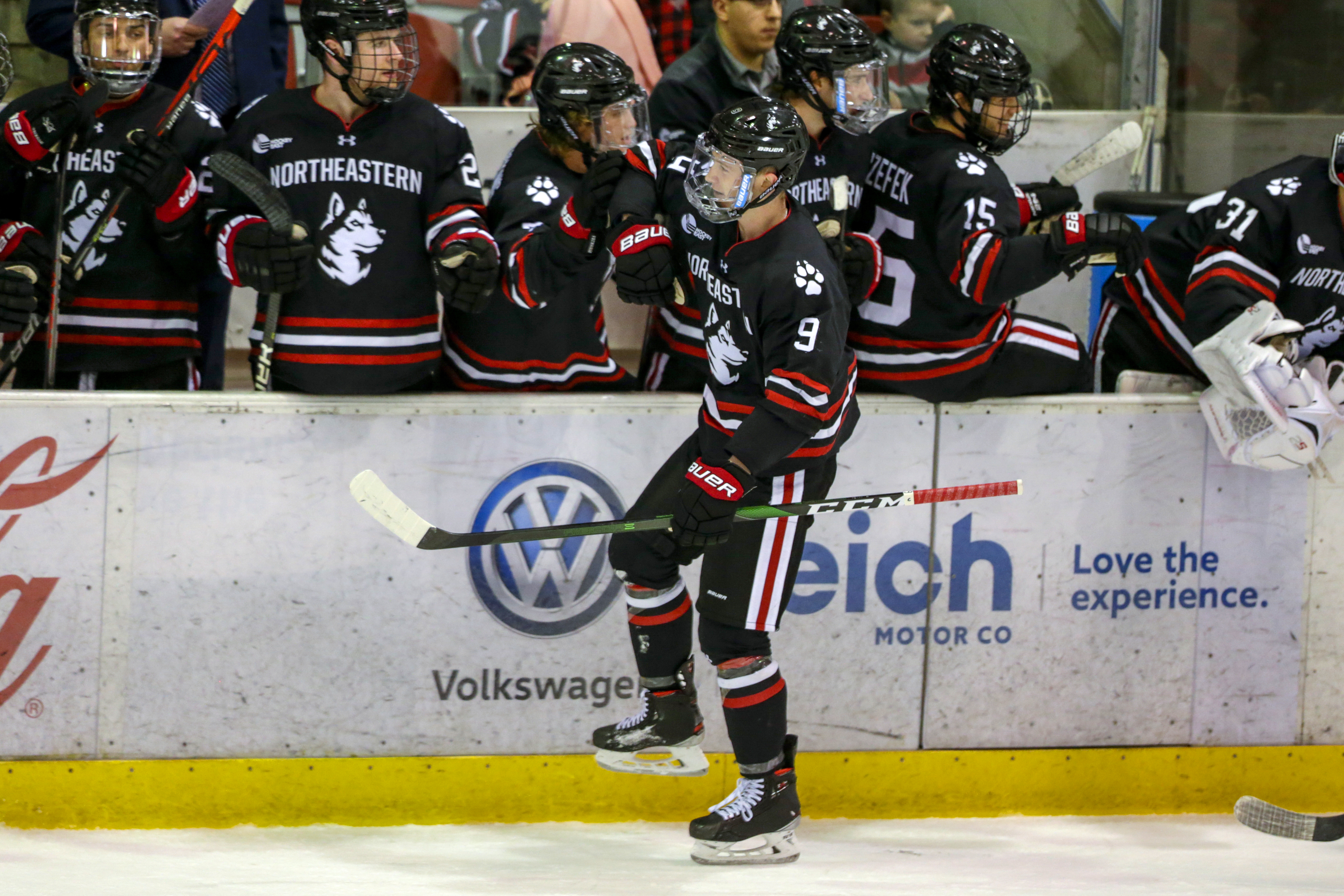 Northeastern center Tyler Madden (9) grew up with a father, John, who played in the NHL, and he critiqued his da’s performance after very game.