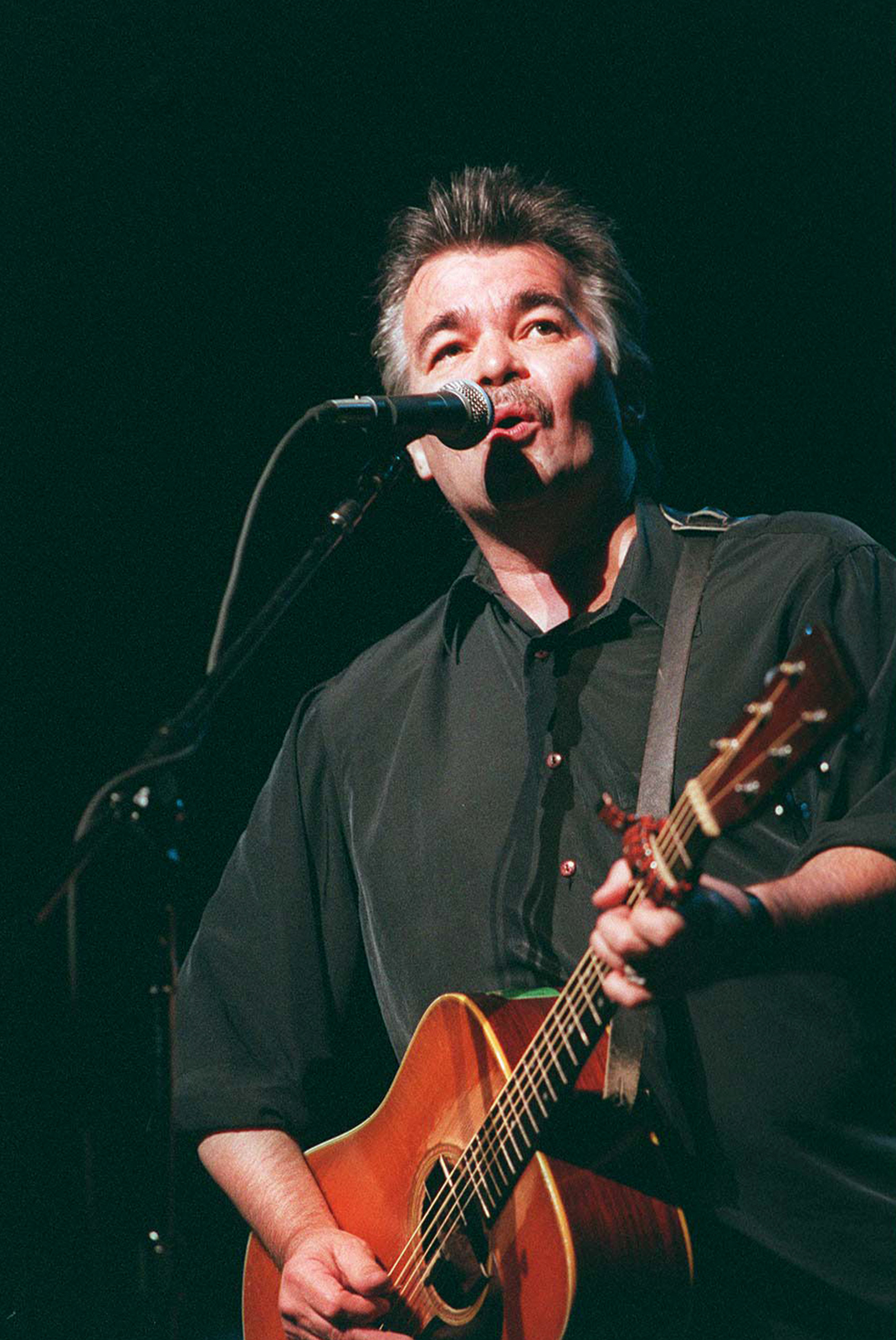 John Prine performing at the Beacon Theater in New York in 1995. The singer-songwriter died April 7, at Vanderbilt University Medical Center in Nashville, from complications of the coronavirus. He was 73.