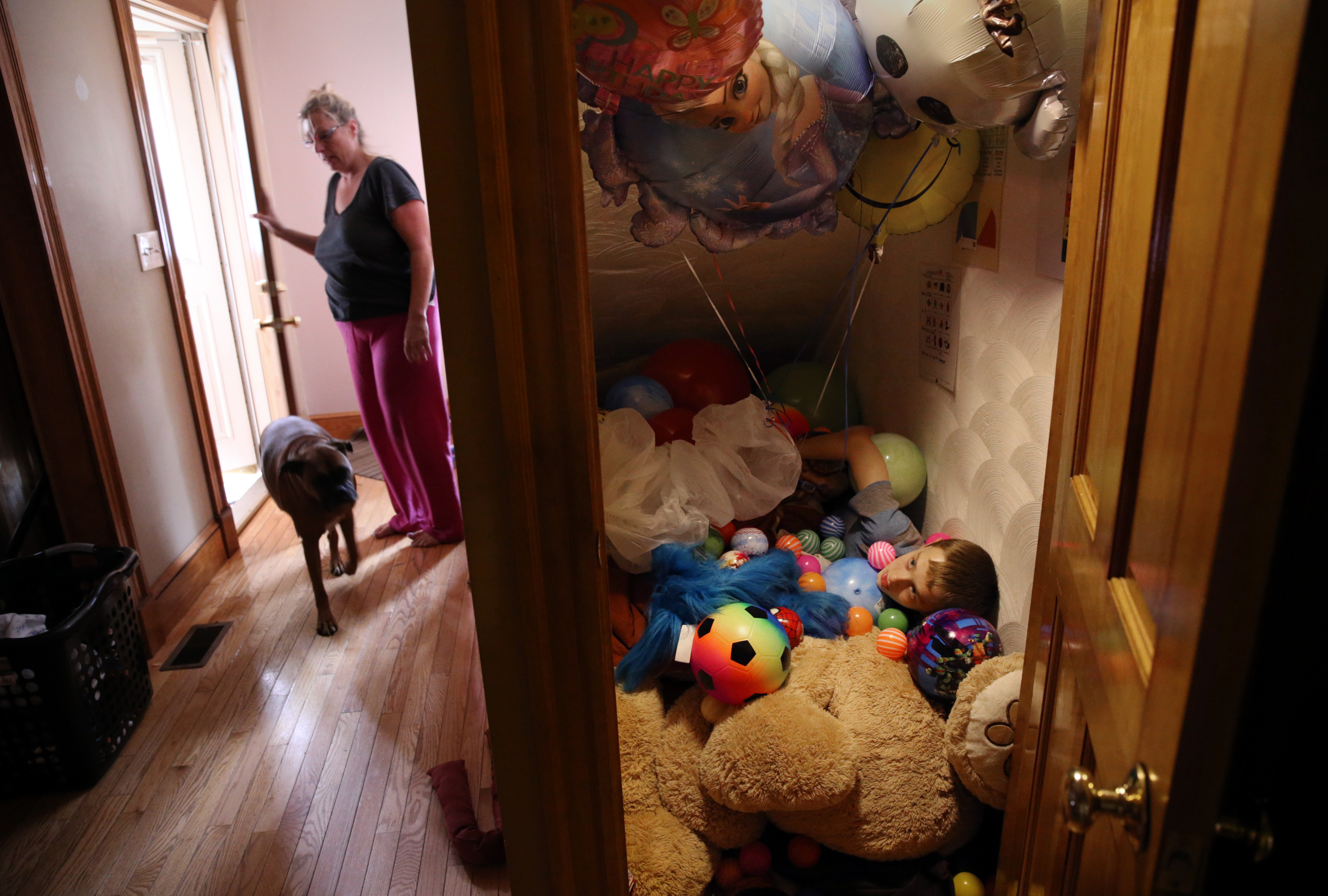 Connor rested in his “sensory closet,’’ while his mother let in the dog at home. Roberta explained that Connor suffers from sensory processing disorder, meaning “he doesn’t know where his body is in space.” The closet under the stairs is filled with comforting objects: pillows, blankets, stuffed animals, toys, and balloons. He buries himself among his favorite things. Roberta said their weight signals his nervous system to calm down. “He can stay in there for hours,’’ she said.