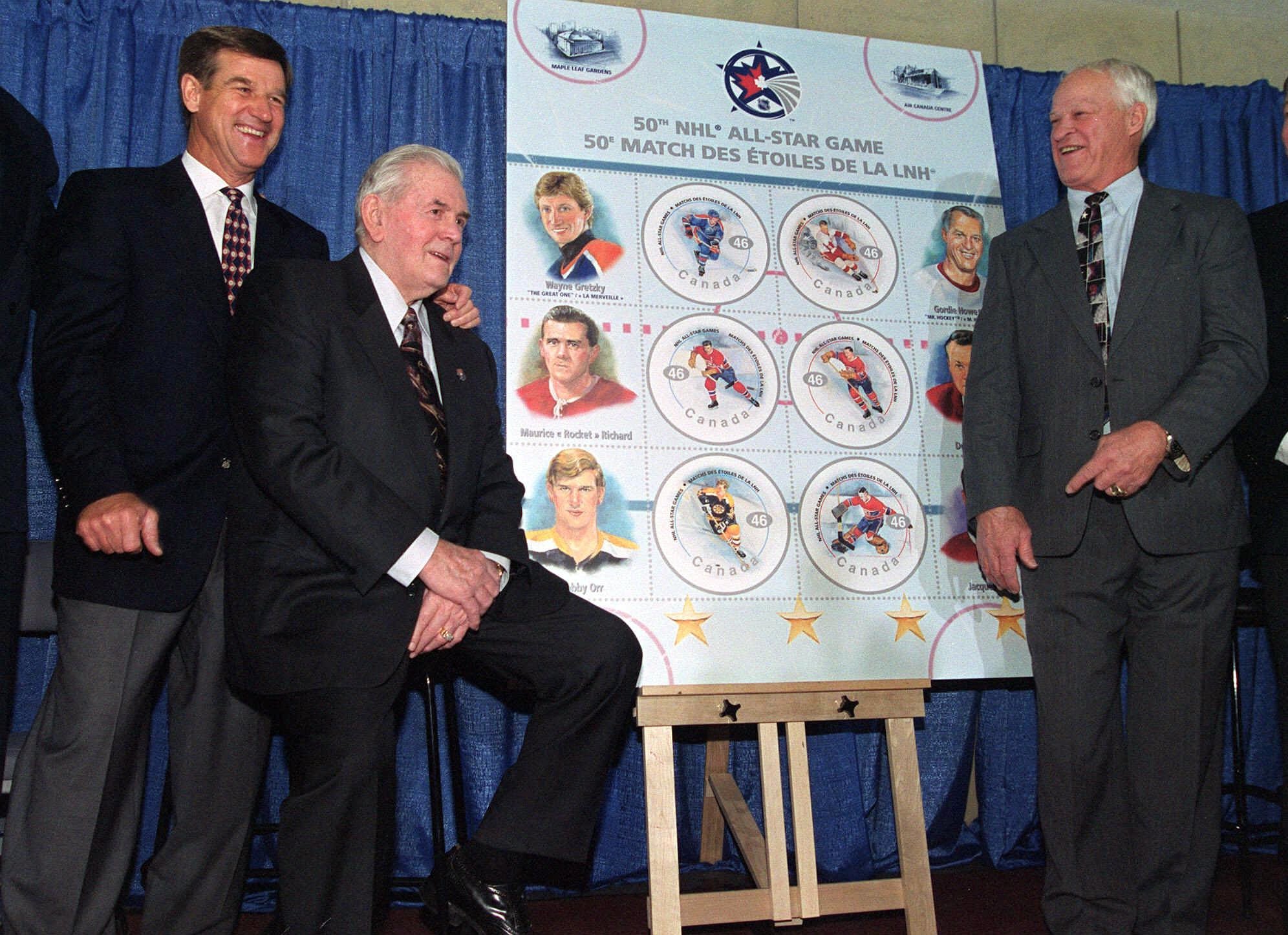 Bobby Orr (left), Maurice Richard (center), and Gordie Howe shared a laugh at the unveiling of commemorative hockey stamps in 2000.