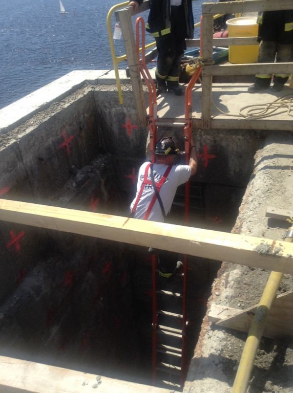The top of the 35-foot-deep hole that the workers were rescued from.