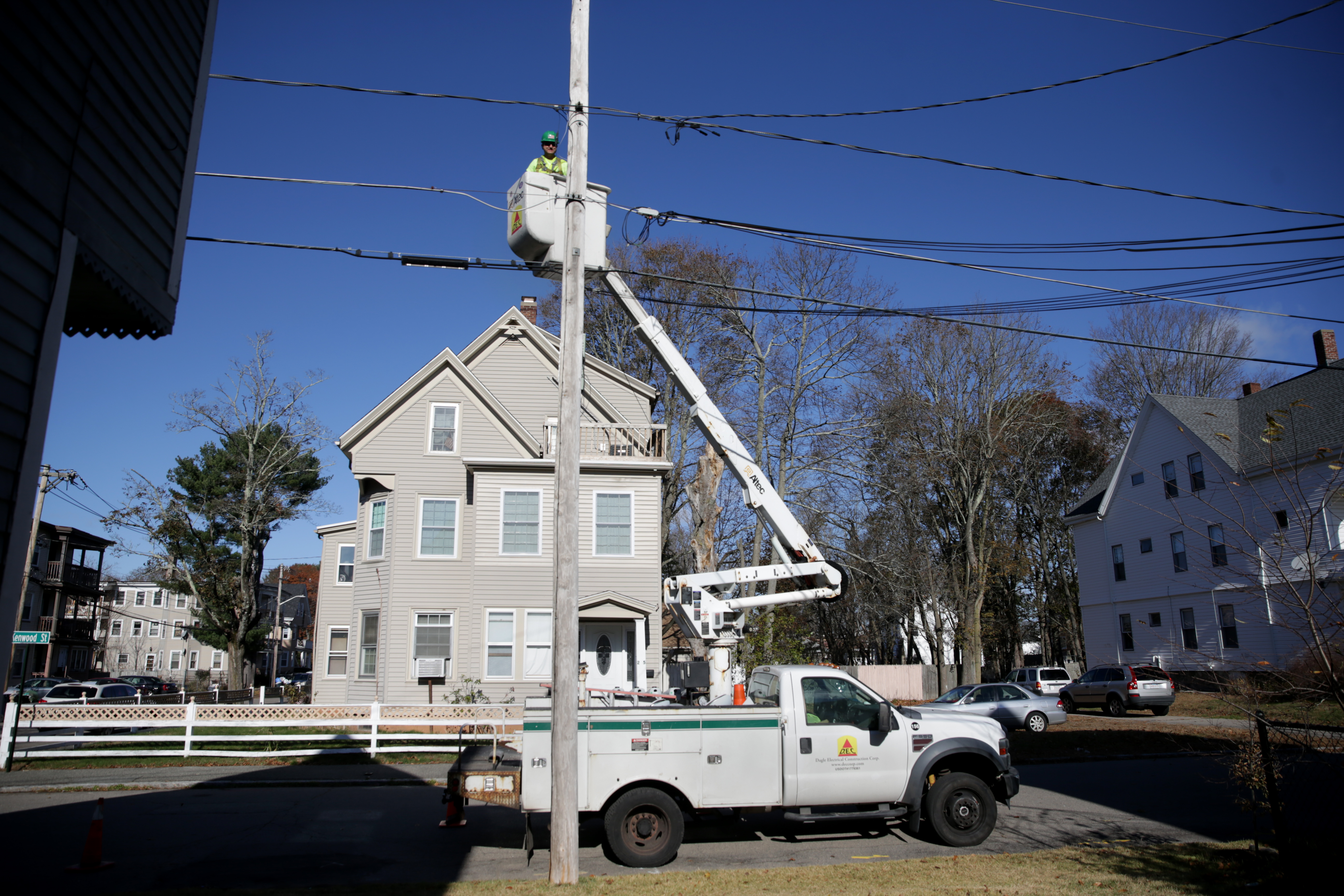 Electrician Brian French at work to replace street lights in Brockton.